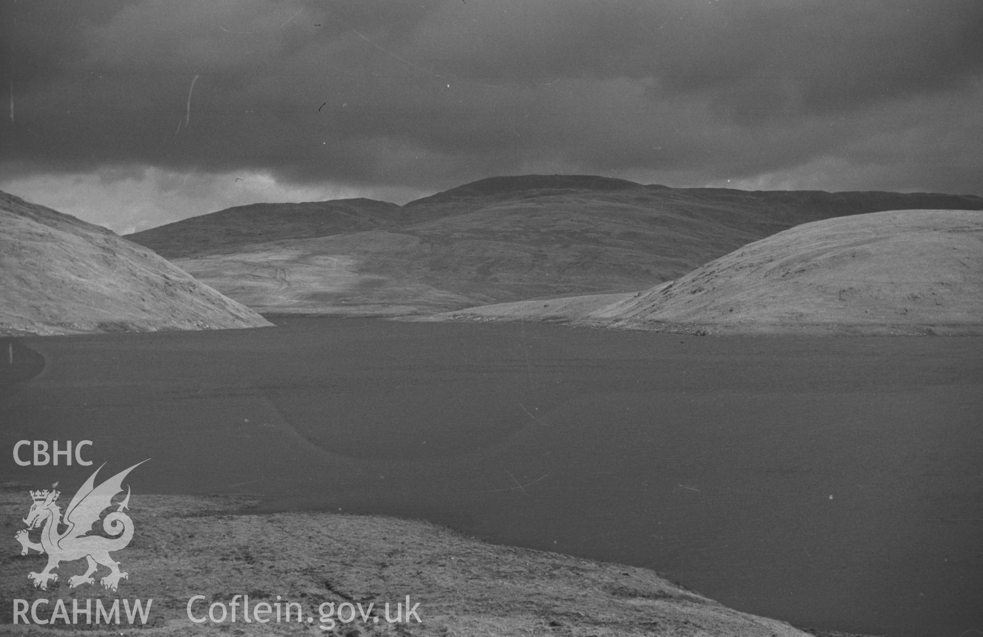 Digital copy of a black and white negative showing the summit of Plynlimon from across Nant-y-Moch reservoir, Blaenrheidol. Photographed by Arthur O. Chater in September 1964 from Grid Reference SN 748 867, looking east.