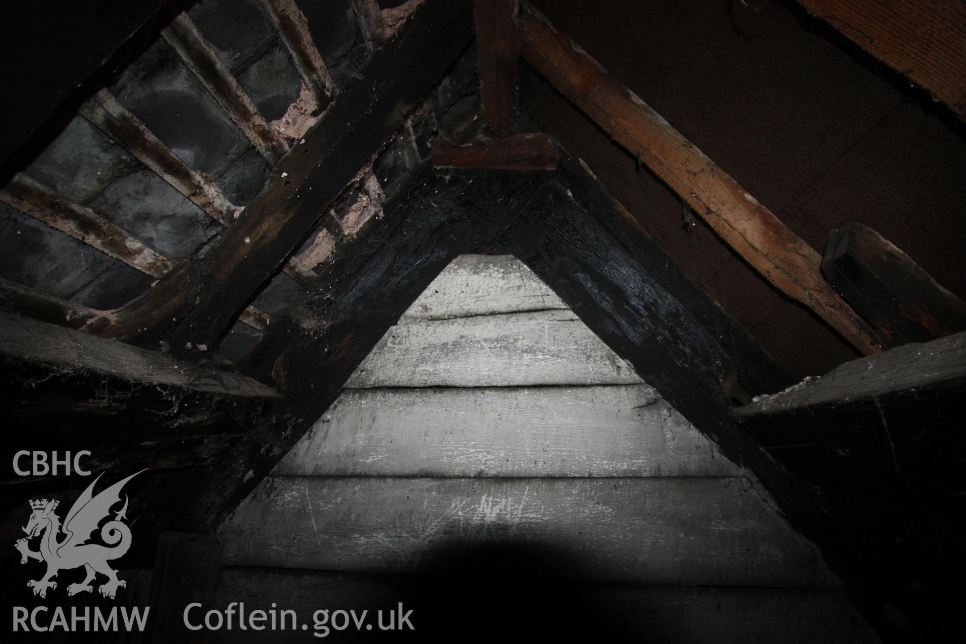 Colour photograph showing interior of timber roof frame at Porth-y-Dwr, 67 Clwyd Street, Ruthin. Photographed during survey conducted by Geoff Ward on 10th June 2013.