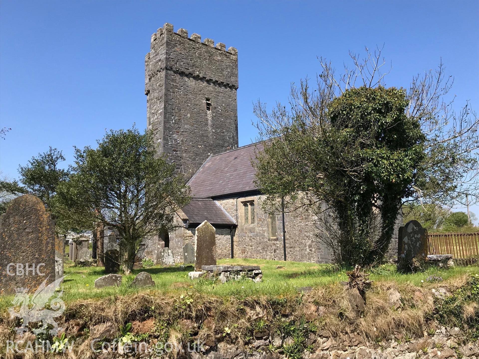 Colour photo showing exterior view of St. Lawrence's church and graveyard, Marros, taken by Paul R. Davis, 6th May 2018.