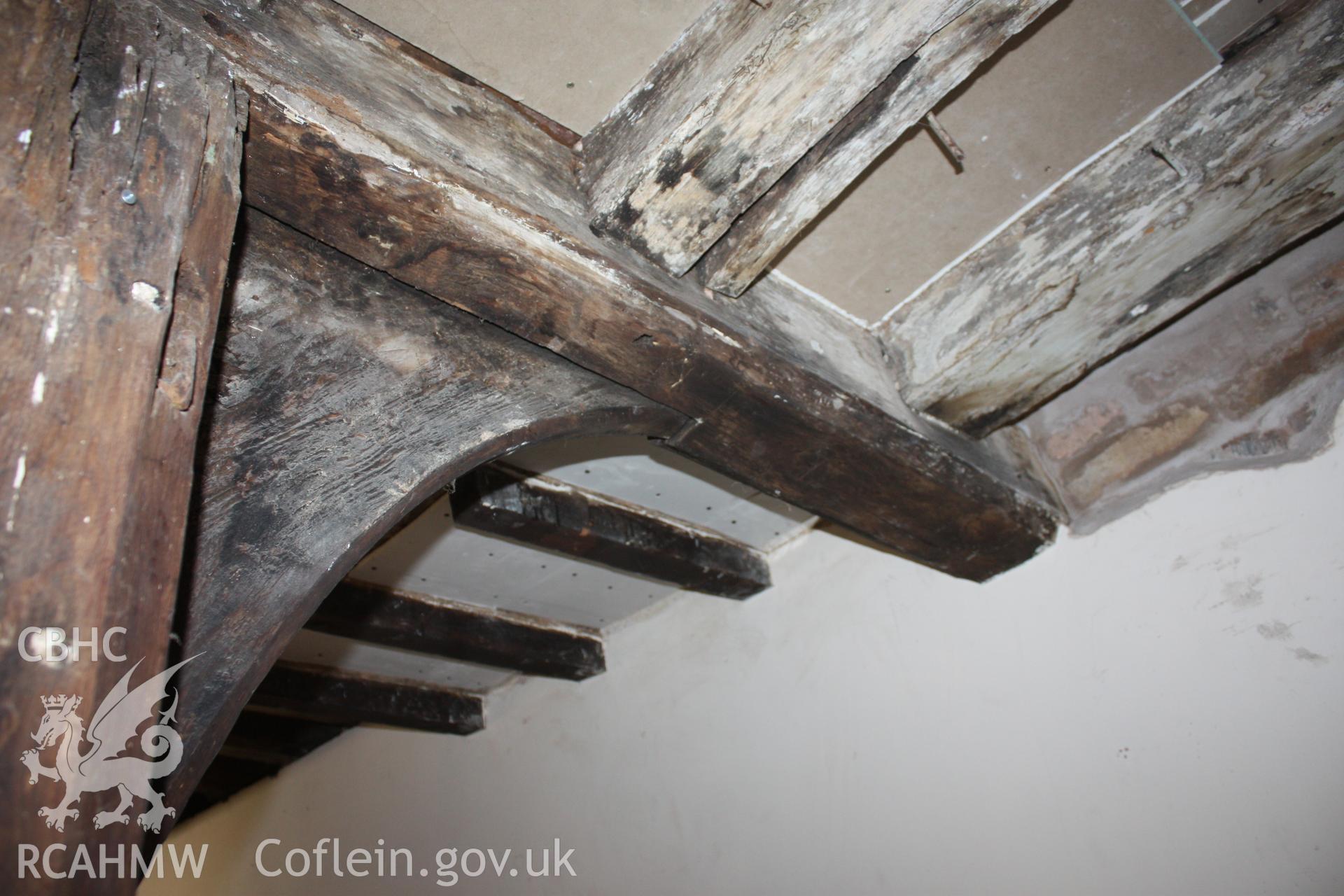 Colour photograph of mortice for bracket and remaining original cantilevered dais joist at Porth-y-Dwr, 67 Clwyd Street, Ruthin. Photographed during survey conducted by Geoff Ward on 10th June 2013.