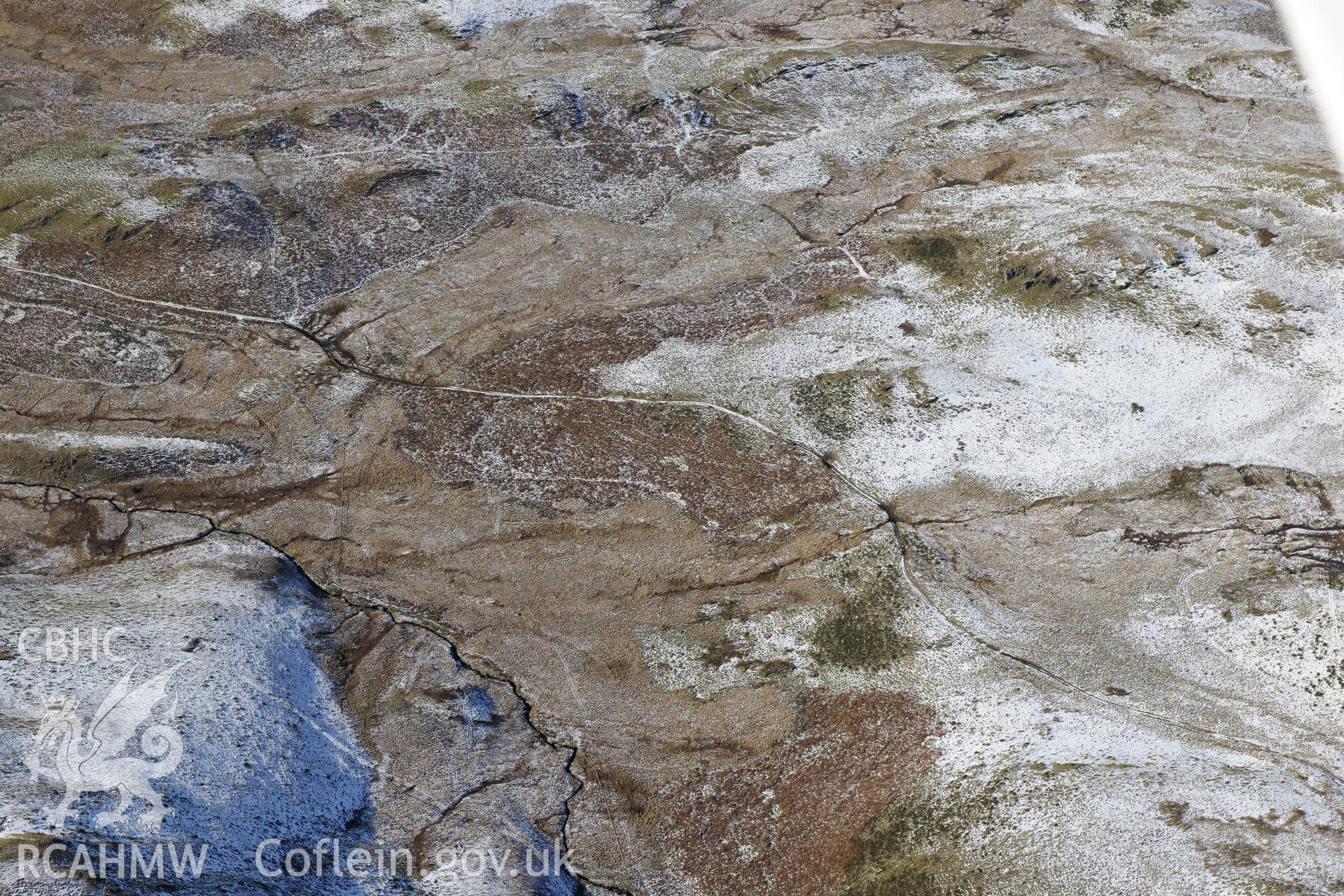 Section of Monks Trod, structure I & II and platform I & II at Banc Blaenegnant, near Teifi Pools, SN785663. Oblique aerial photograph taken during the Royal Commission?s programme of archaeological aerial reconnaissance by Toby Driver, 4th February 2015.