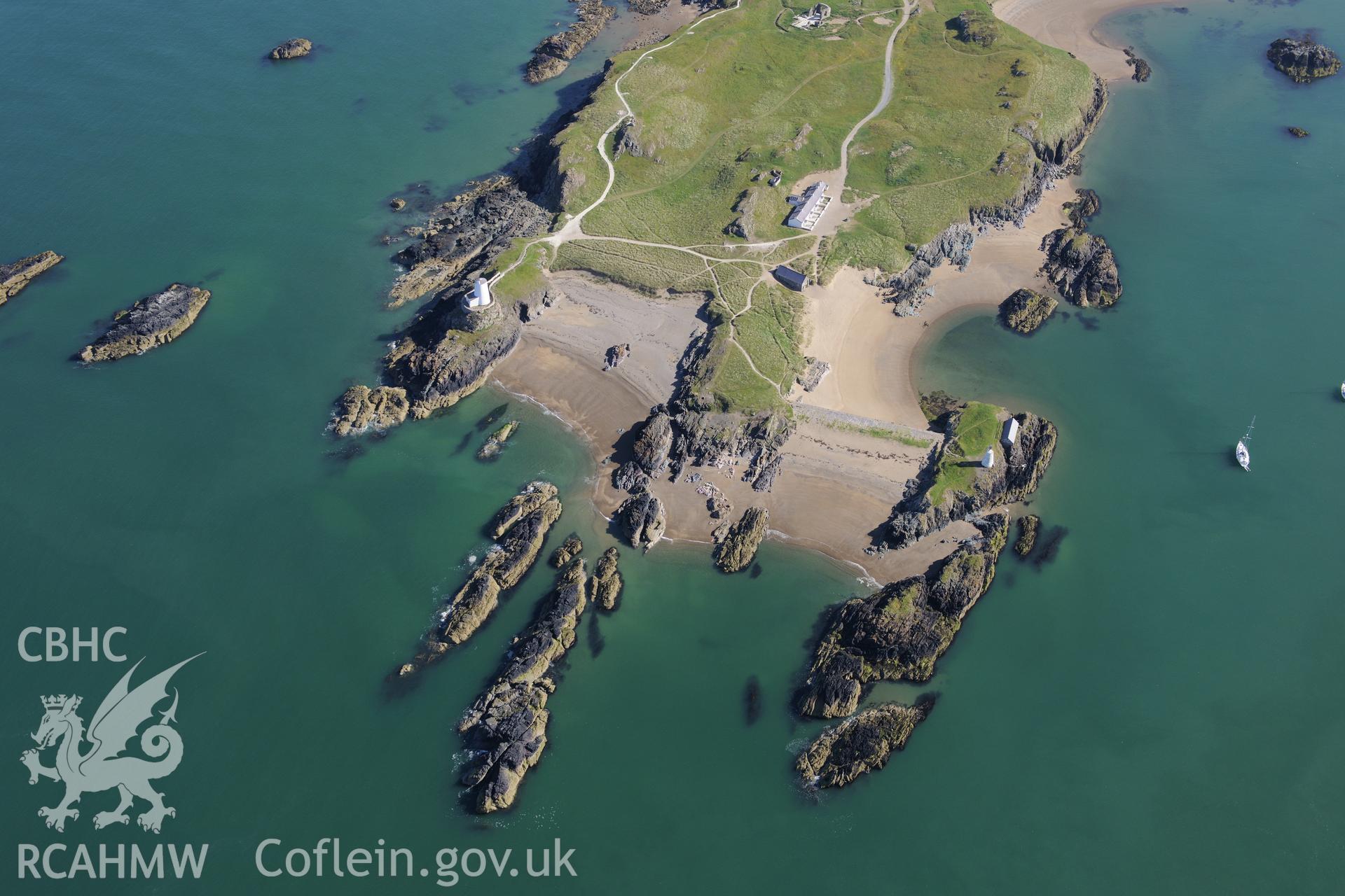 The lighthouse, tower, pilot's house and St. Dwynwen's Church on Llanddwyn Island. Oblique aerial photograph taken during the Royal Commission's programme of archaeological aerial reconnaissance by Toby Driver on 23rd June 2015.