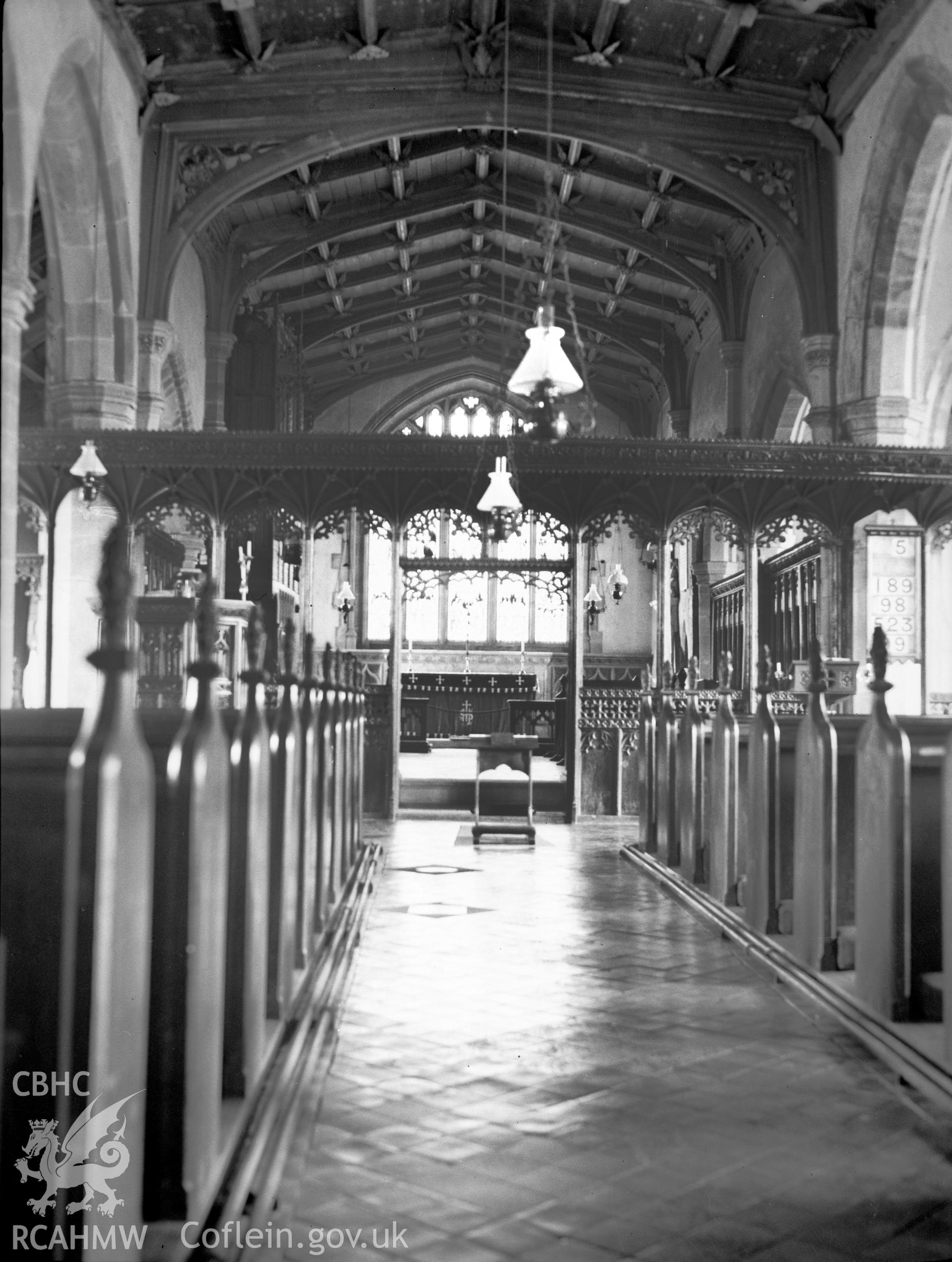Digital copy of a nitrate negative showing view of interior, nave and screen from west, St Stephen's Church, Old Radnor. From the National Building Record Postcard Collection.