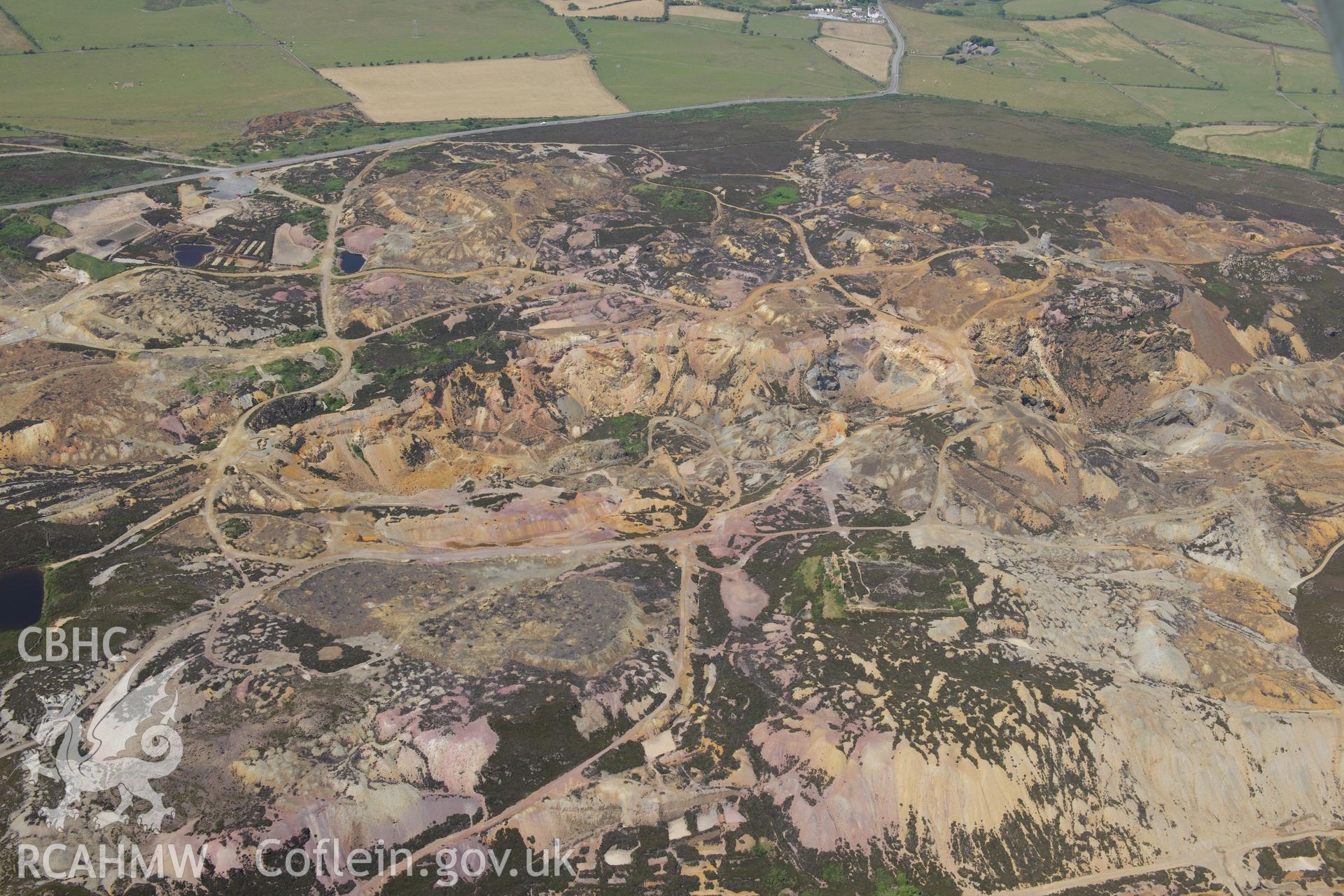 Parys Mountain copper mines, Amlwch, Anglesey. Oblique aerial photograph taken during the Royal Commission?s programme of archaeological aerial reconnaissance by Toby Driver on 12th July 2013.