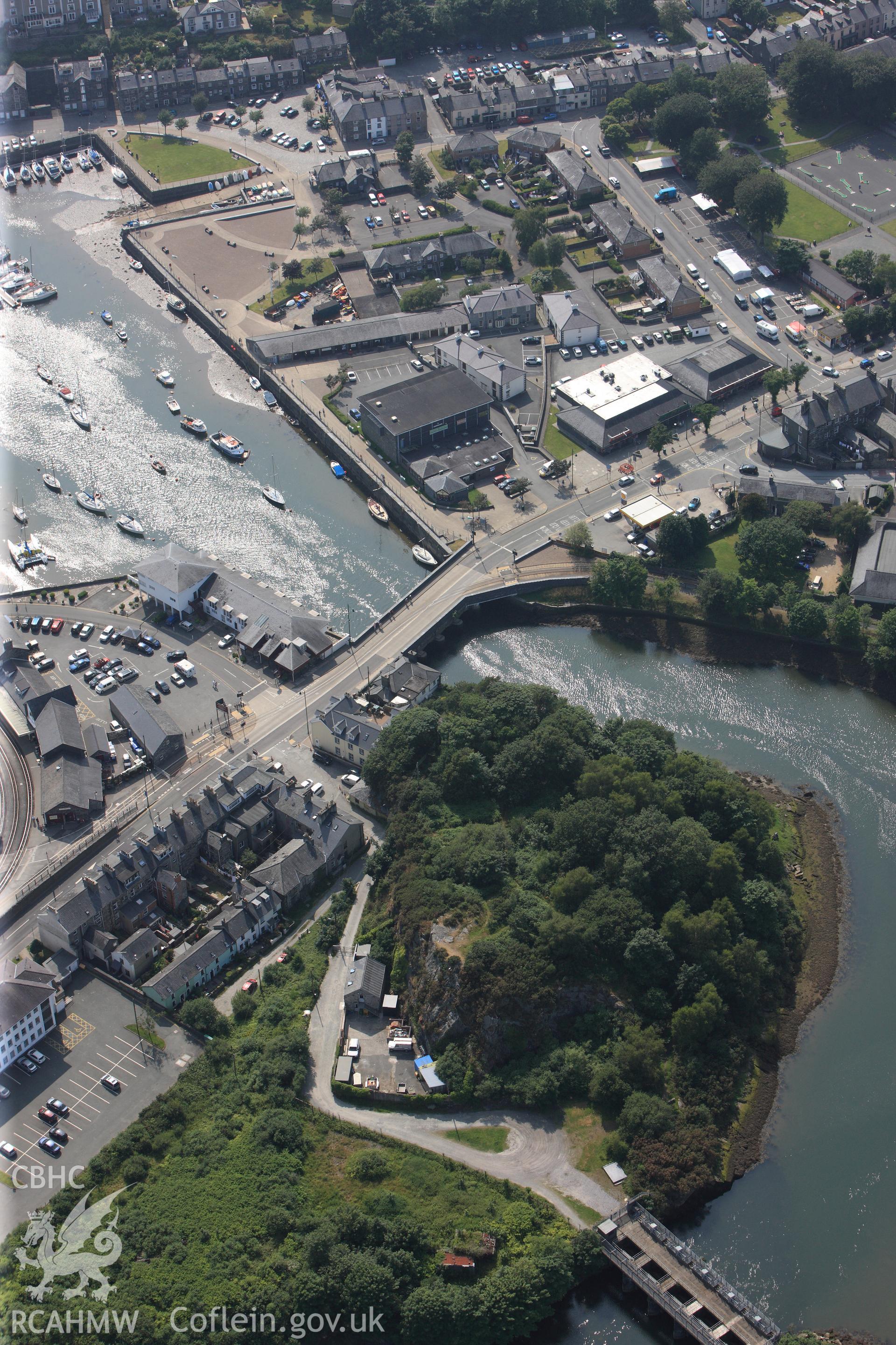 Porthmadog harbour and associated railway station, Porthmadog. Oblique aerial photograph taken during the Royal Commission?s programme of archaeological aerial reconnaissance by Toby Driver on 12th July 2013.