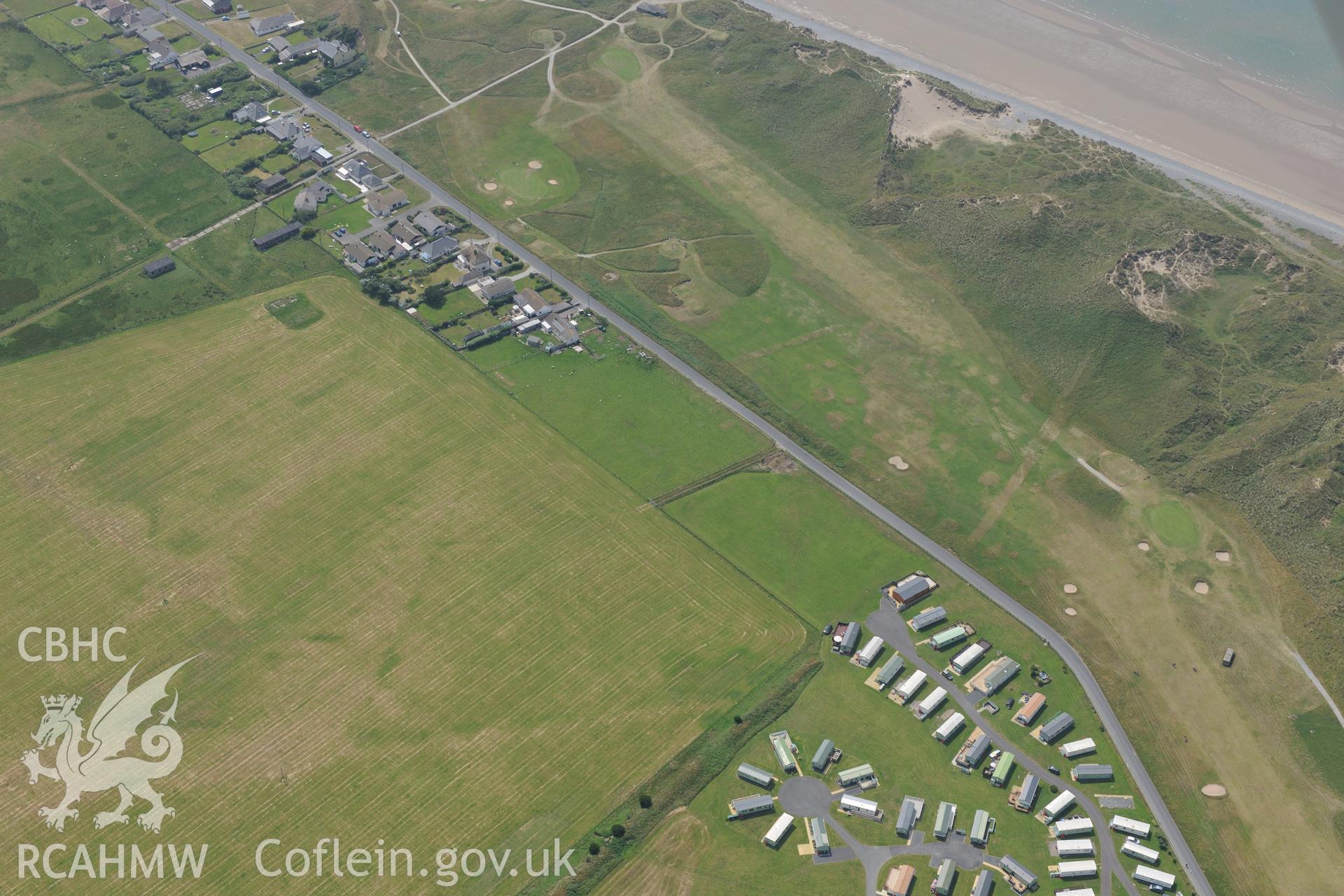 Ynyslas rocket range and the village of Ynys Las, Ceredigion. Oblique aerial photograph taken during the Royal Commission?s programme of archaeological aerial reconnaissance by Toby Driver on 12th July 2013.