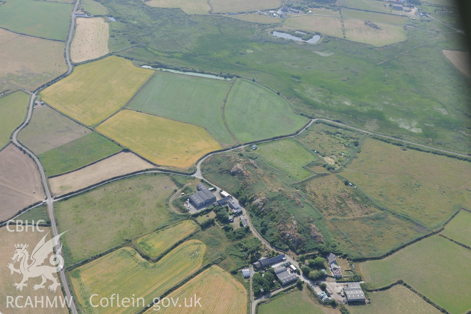 Clegyr Boia defended settlement, west of St Davids. Oblique aerial photograph taken during the Royal Commission?s programme of archaeological aerial reconnaissance by Toby Driver on 16th July 2013.