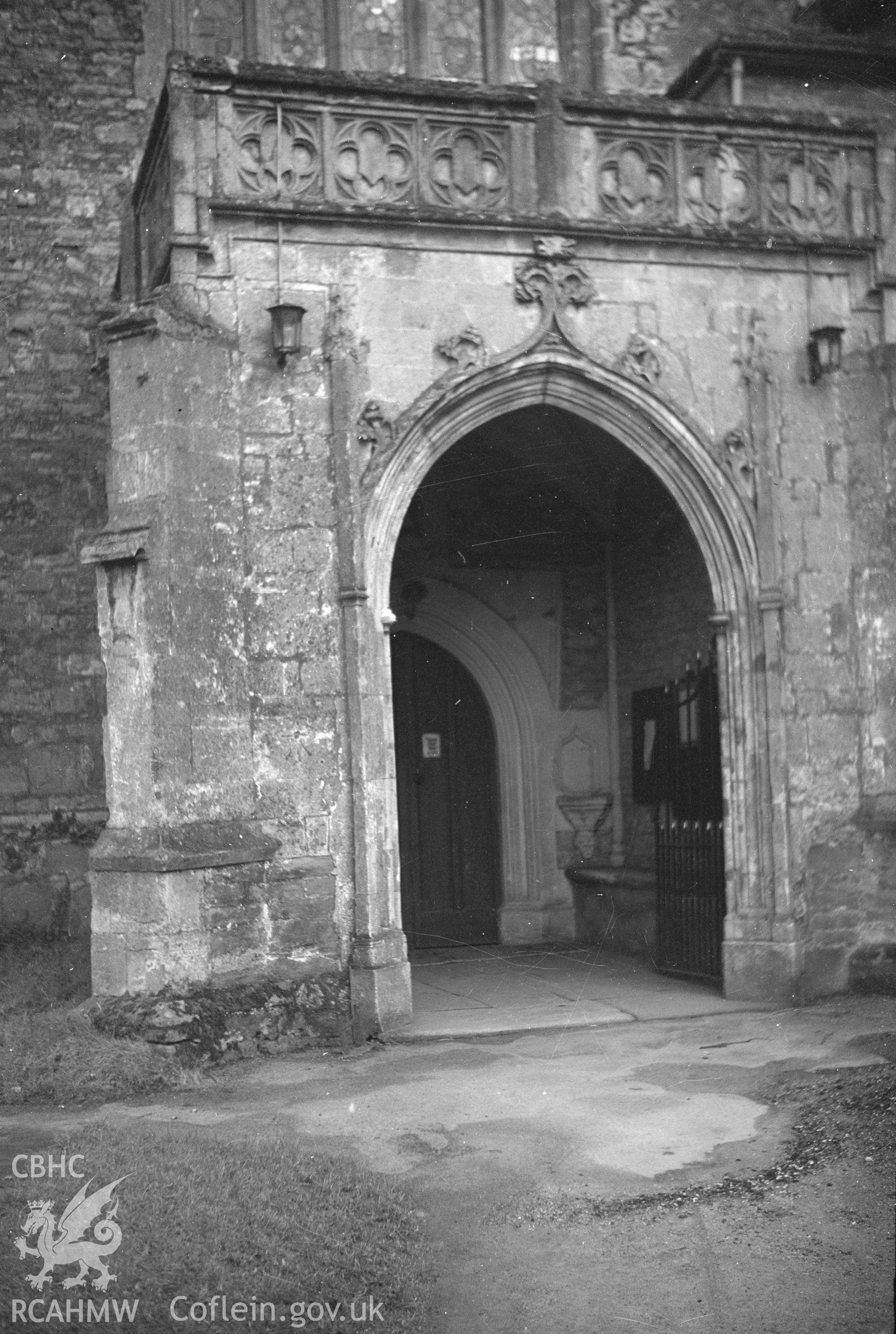 Digital copy of a nitrate negative showing the western porch of the north aisle at St Mary's Church, Usk, taken by Leonard Monroe.
