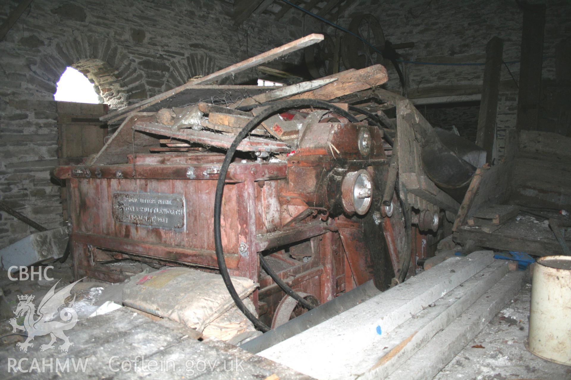 Interior view of threshing house showing threshing machine. Photographic survey of the threshing machine in the threshing house at Tan-y-Graig Farm, Llanfarian. Conducted by Geoff Ward and John Wiles 11th December 2016.
