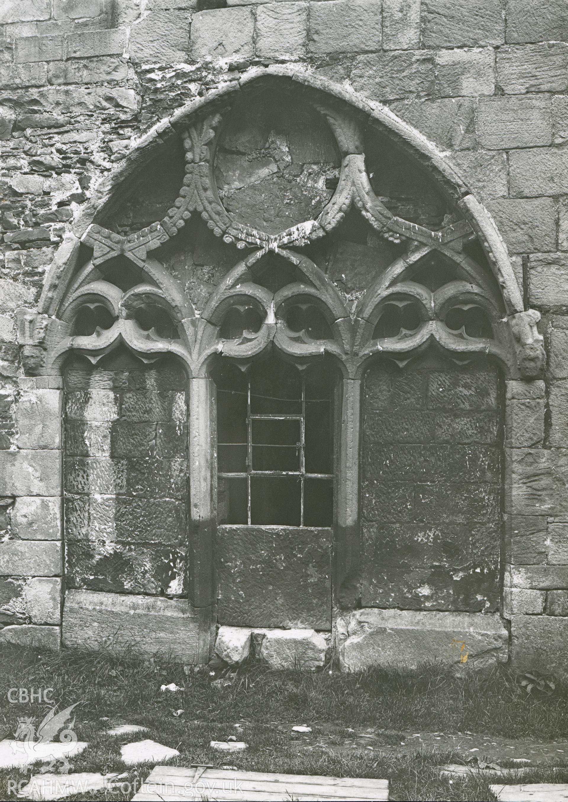 Digitised copy of a black and white photograph showing window of chapter house at Valle Crucis Abbey, taken by F.H. Crossley, 1949. Copied from print as negative held by NMR England (Historic England).