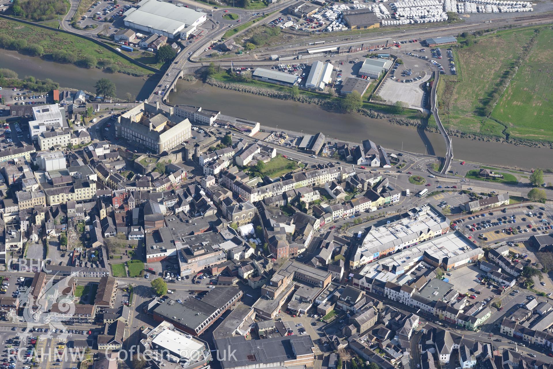 Carmarthen, including view of harbour, bridge, castle, gaol and quay. Oblique aerial photograph taken during the Royal Commission's programme of archaeological aerial reconnaissance by Toby Driver on 21st April 2015