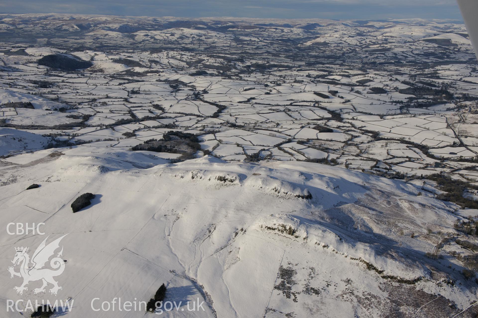 Enclosures on the Llandegley Rocks, east of Llandrindod Wells. Oblique aerial photograph taken during the Royal Commission?s programme of archaeological aerial reconnaissance by Toby Driver on 15th January 2013.