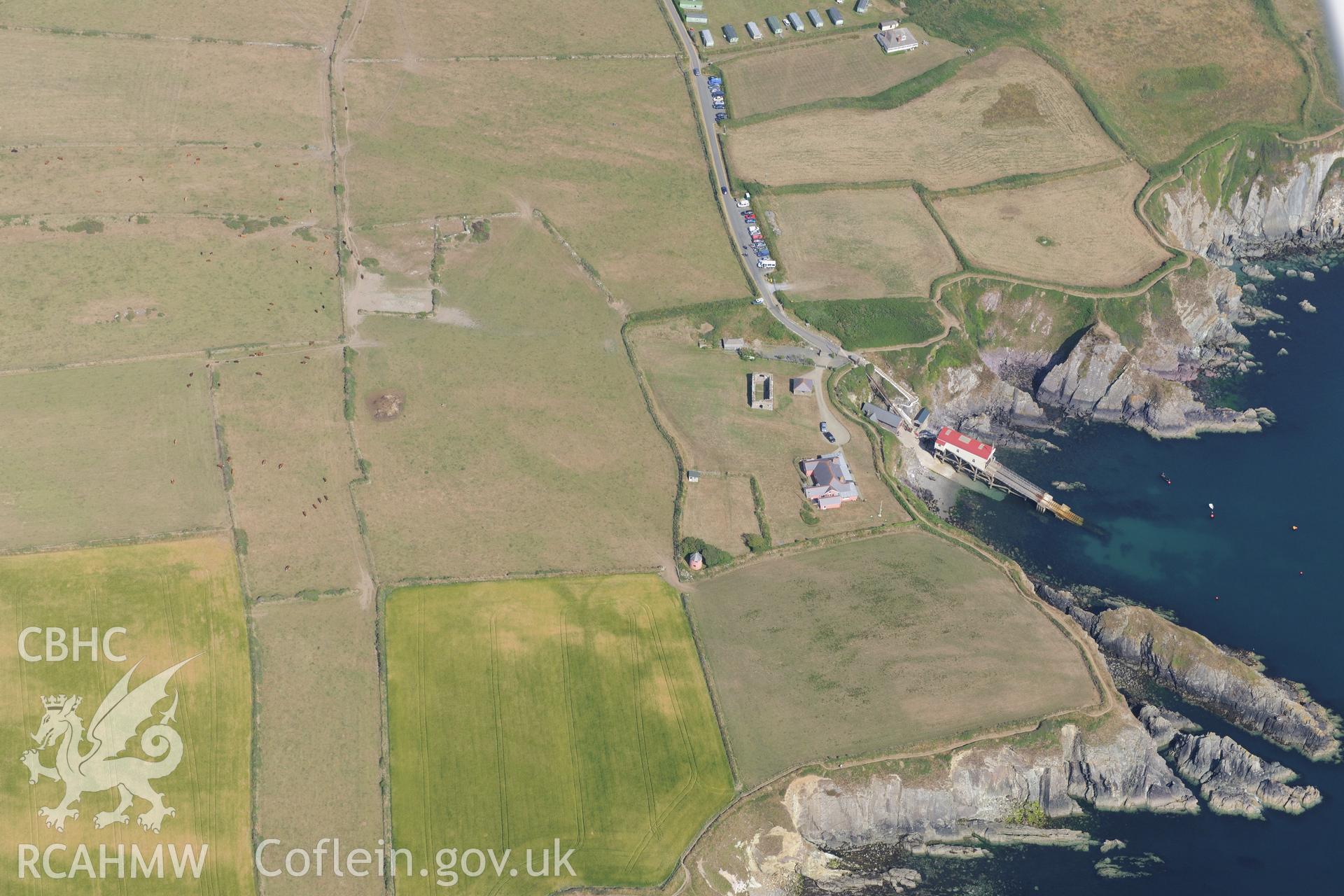 St David's lifeboat station and new lifeboat station; St Justinian's bungalow; St Justinian's chapel and St Justinian's well. Oblique aerial photograph taken during the Royal Commission?s programme of archaeological aerial reconnaissance by Toby Driver on 16th July 2013.