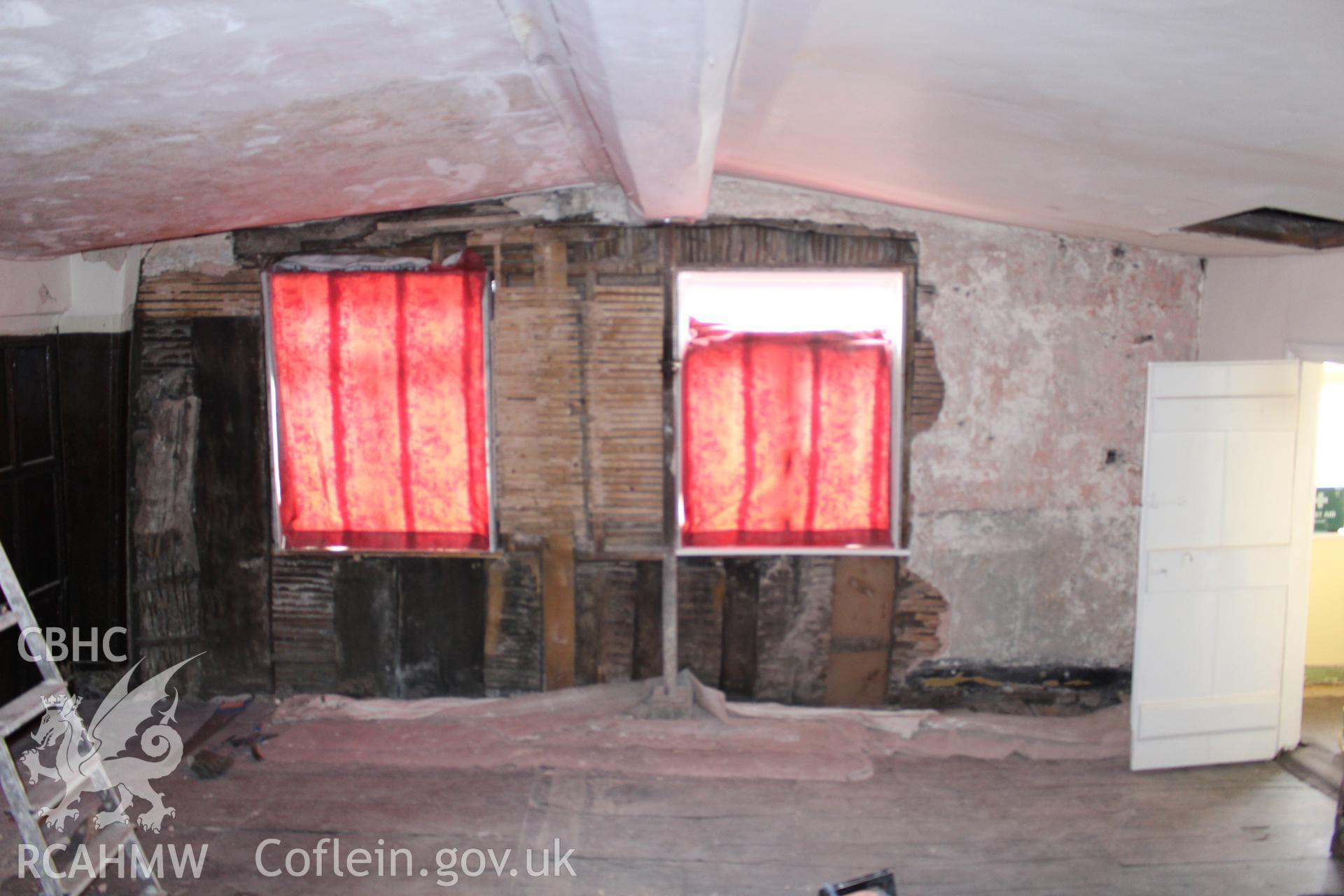 Colour photograph showing interior view of partially exposed wattle and daub wall at Porth y Dwr, Clwyd Street, Ruthin. Photograph taken during survey conducted by Geoff Ward on 9th October 2014.