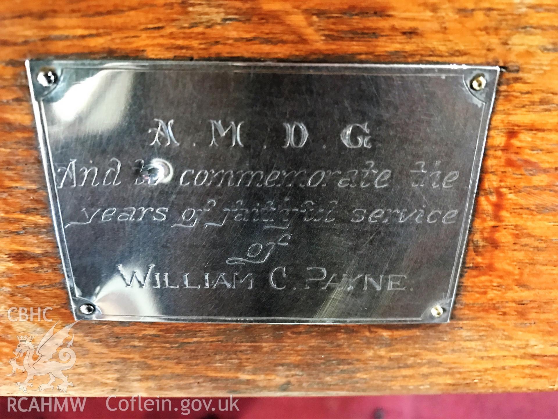 Colour photo showing view of plaque on the free-standing pews at St Paul's Church, Grangetown, taken by Revd David T. Morris, 2018.