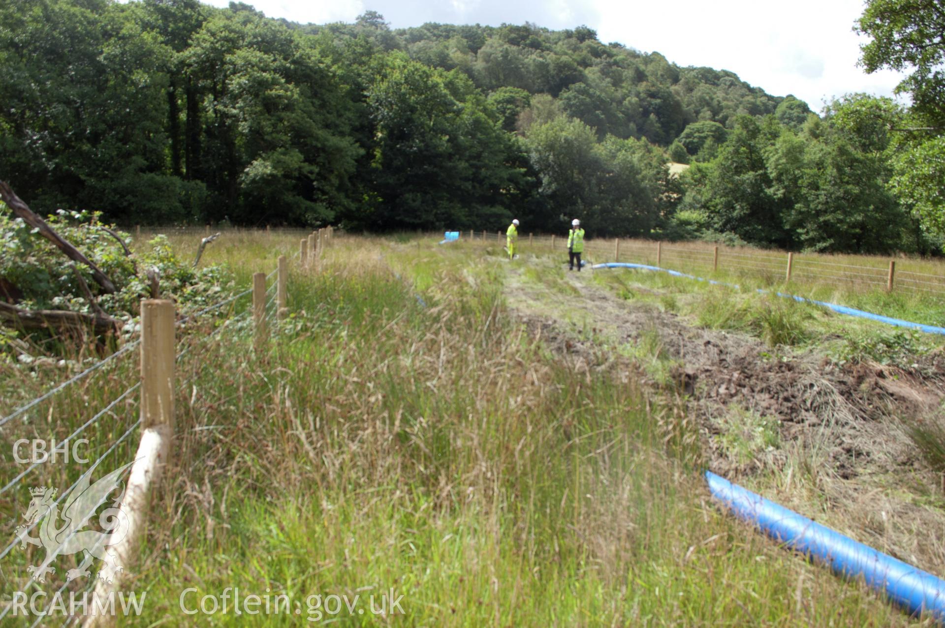 Digital photograph showing general view looking south along the pipeline route. Photographed during Gwynedd Archaeological Trust's archaeological watching brief of water main renewal in Dolgellau on 28th July 2017. Project no. G2528.