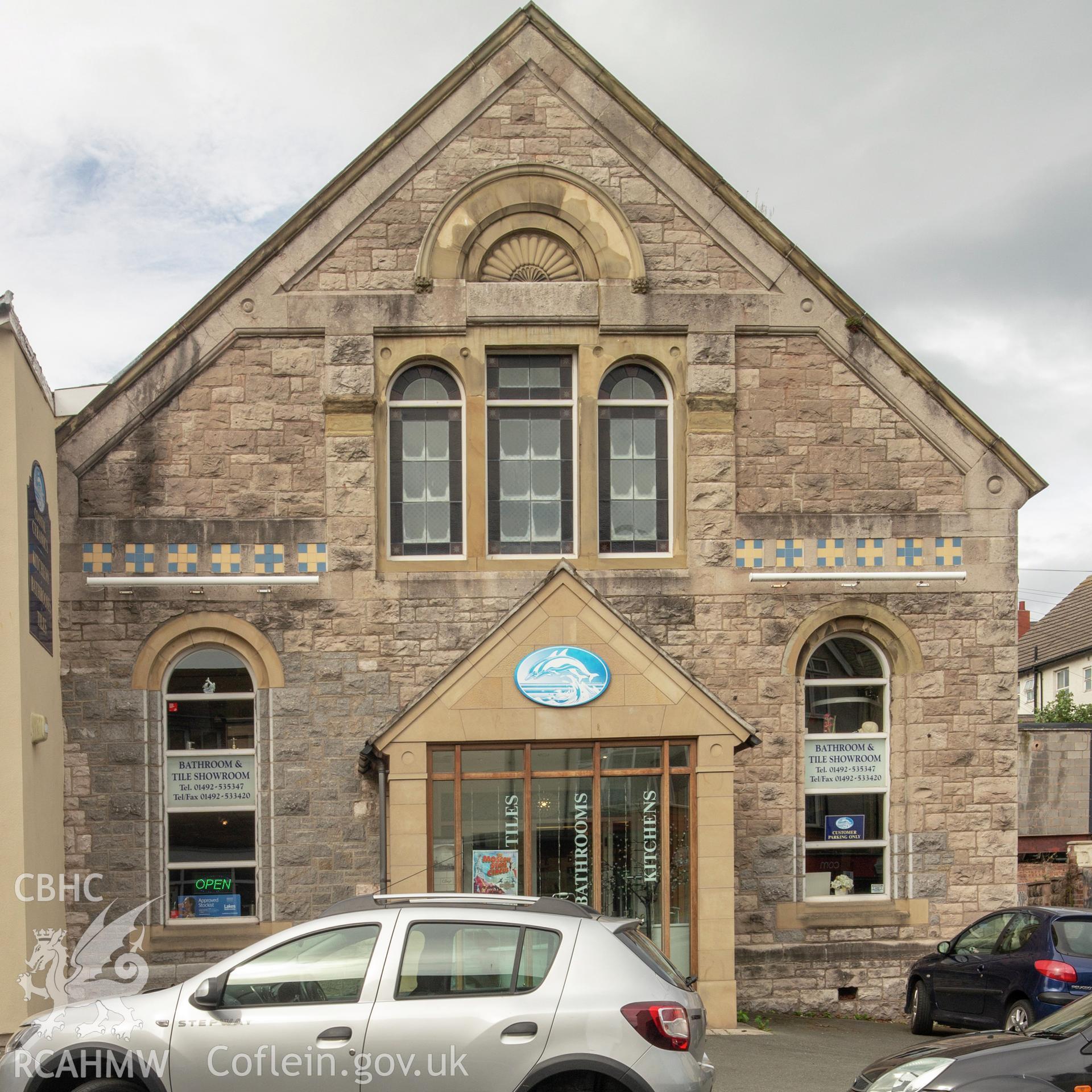 Colour photograph showing front elevation and entrance of former Seion Wesleyan Methodist Chapel, now a bathroom and tile show room, Colwyn Bay. Photographed by Richard Barrett on 17th September 2018.