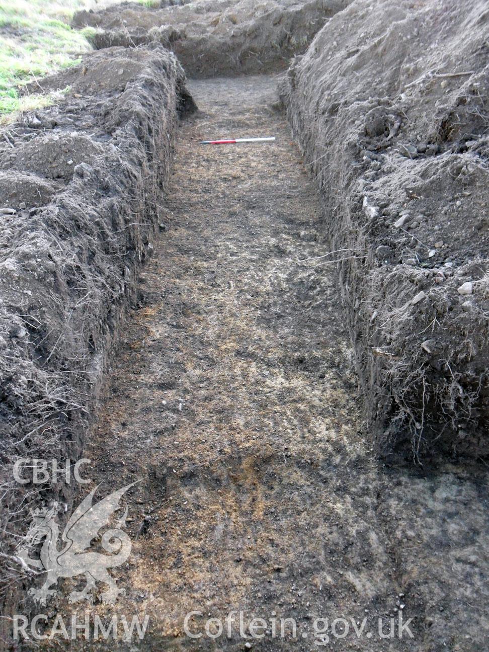 Digital colour photograph showing archaeological investigation at Upper House Farm, Painscastle, Powys. Included as material relating to archaeological field evaluation of Upper House Farm, written by Chris E Smith of Archaeology Wales.