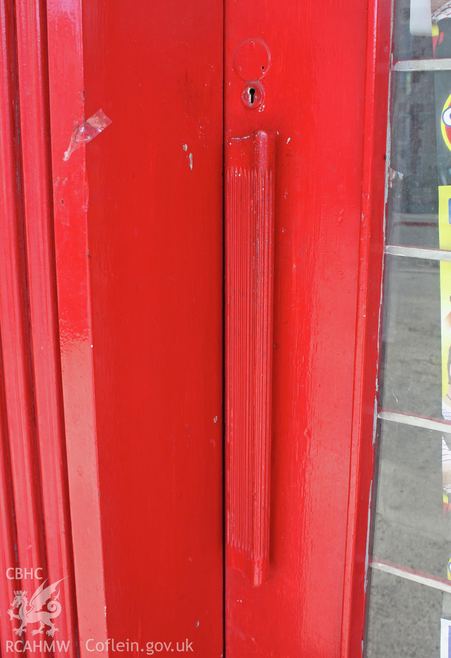 Colour photograph showing detail of the handle on the entrance door to the petrol station on Rhyl Road, Denbigh. Photographic survey conducted by Sue Fielding on 26th August 2011.