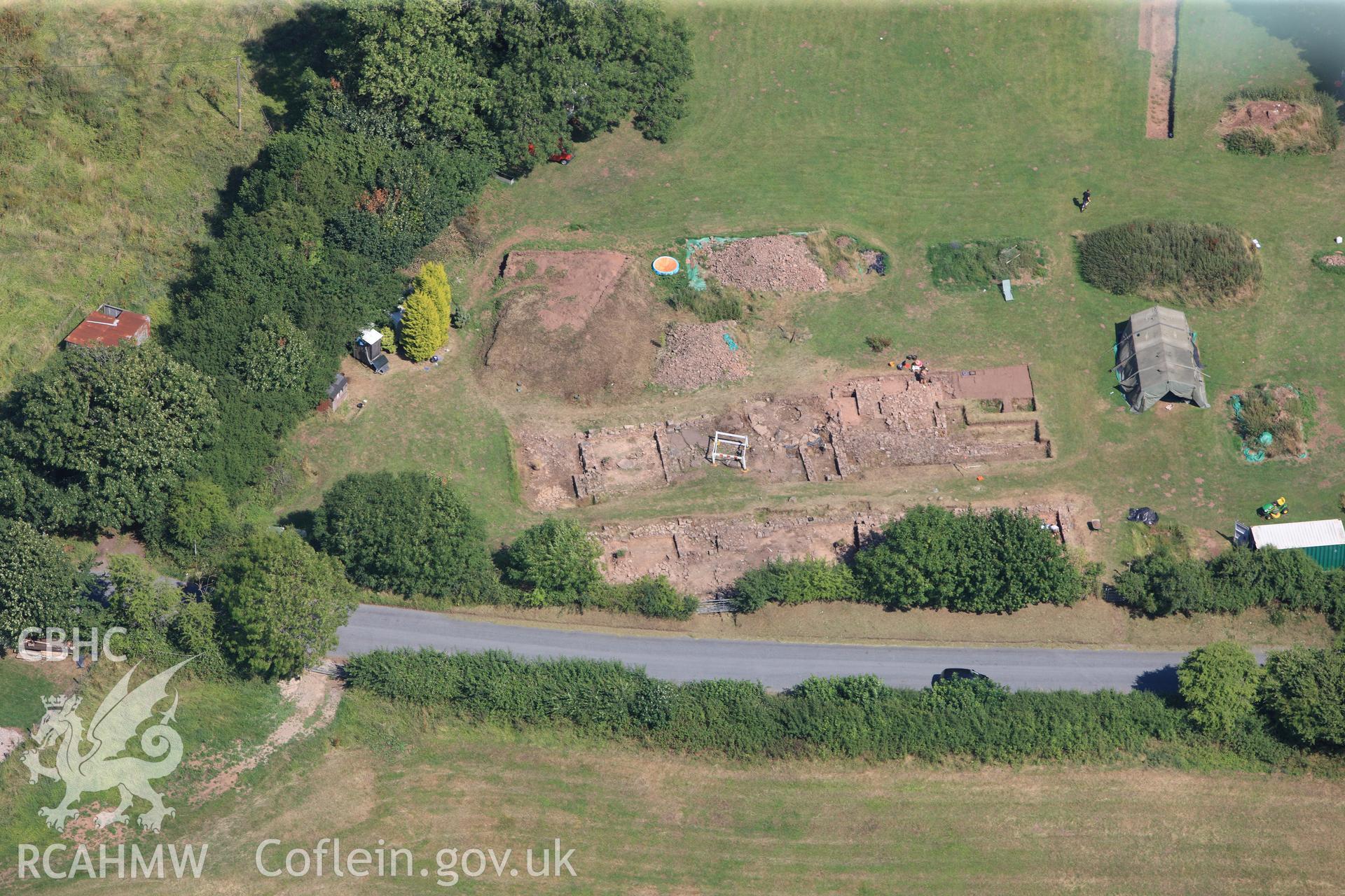 Excavations immediately south of Trellech shrunken medieval village. Oblique aerial photograph taken during the Royal Commission?s programme of archaeological aerial reconnaissance by Toby Driver on 1st August 2013.