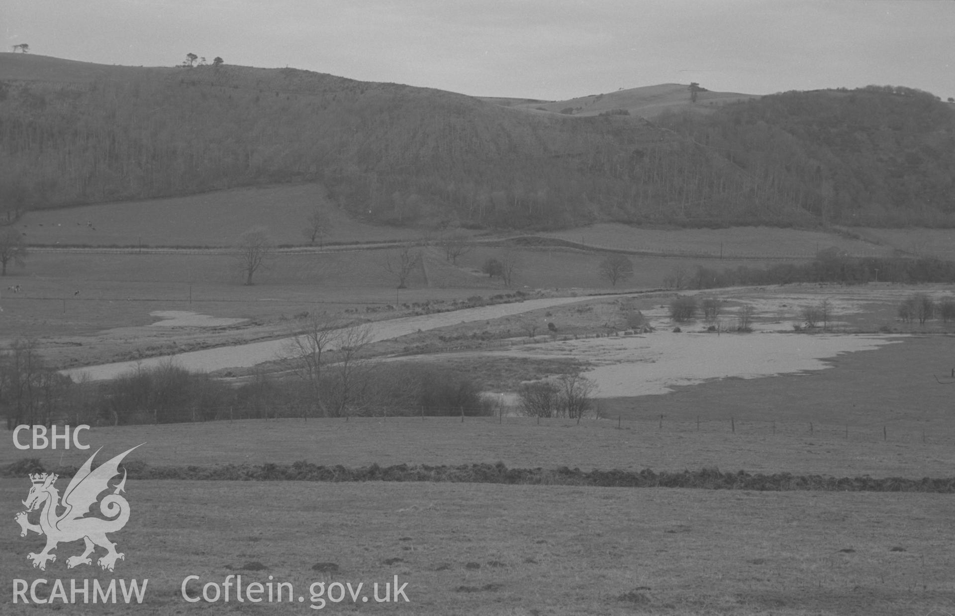 Digital copy of a black and white negative showing flooding of the river Ystwyth just below Abermad. Photographed by Arthur O. Chater in December 1964 from Grid Reference SN 595 764, looking north east - north. (Panorama, photograph 2 of 2).