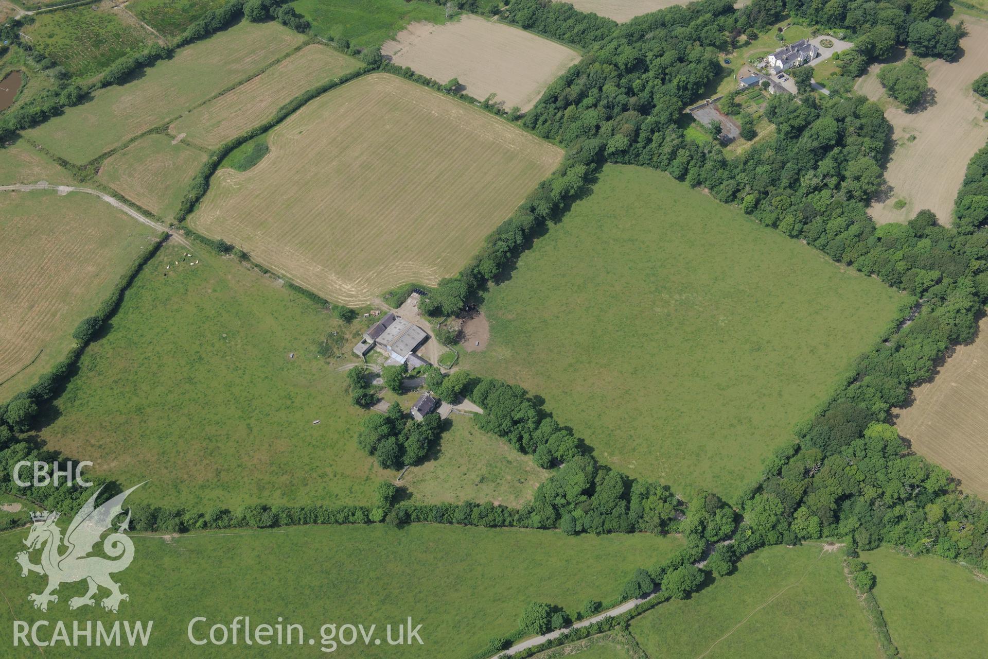Llynnon Hall, including view of the lodge and garden, Llanddeusant, north east of Holyhead. Oblique aerial photograph taken during the Royal Commission?s programme of archaeological aerial reconnaissance by Toby Driver on 12th July 2013.