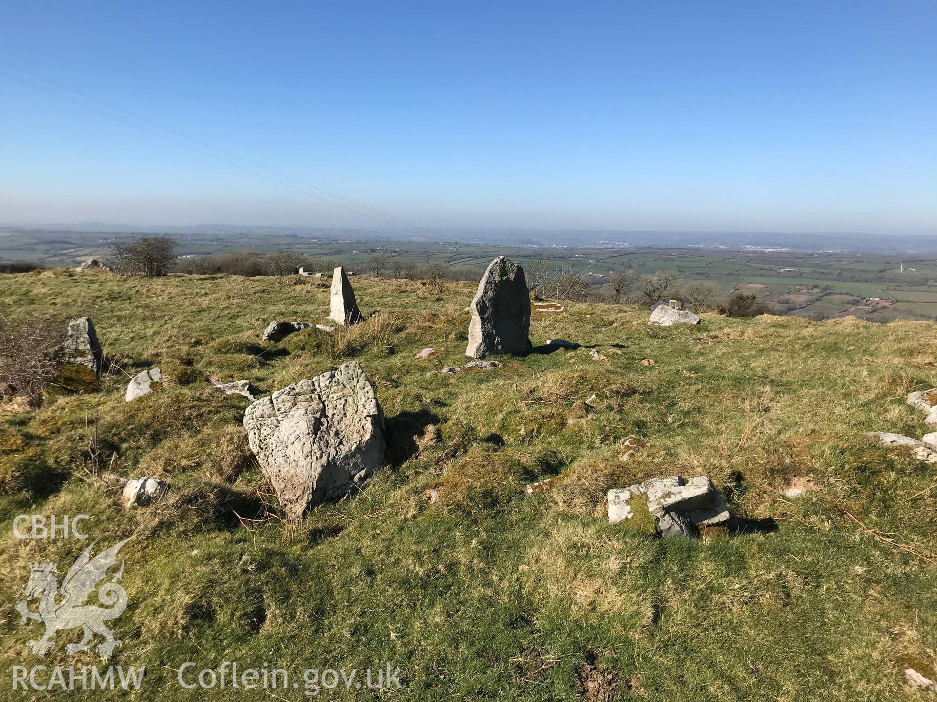 Digital colour photograph of a round cairn or kerb circle on Mynydd Llangyndeyrn, east of Crwbin, taken by Paul R. Davis on 26th February 2019.