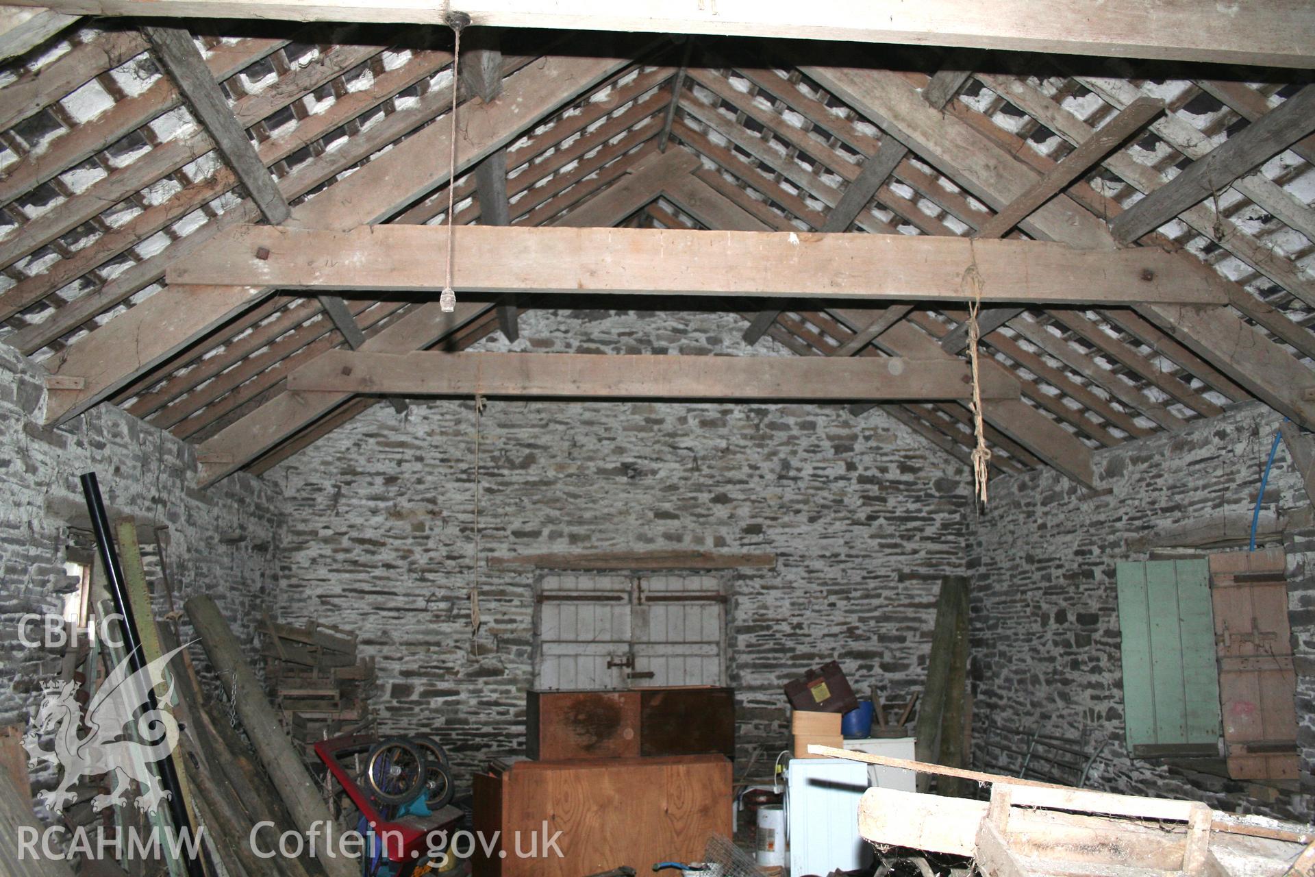 Interior view of first floor of the complex showing wooden beams. Photographic survey of the threshing house, straw house, mixing house and root house at Tan-y-Graig Farm, Llanfarian, conducted by Geoff Ward and John Wiles, 11th December 2006.