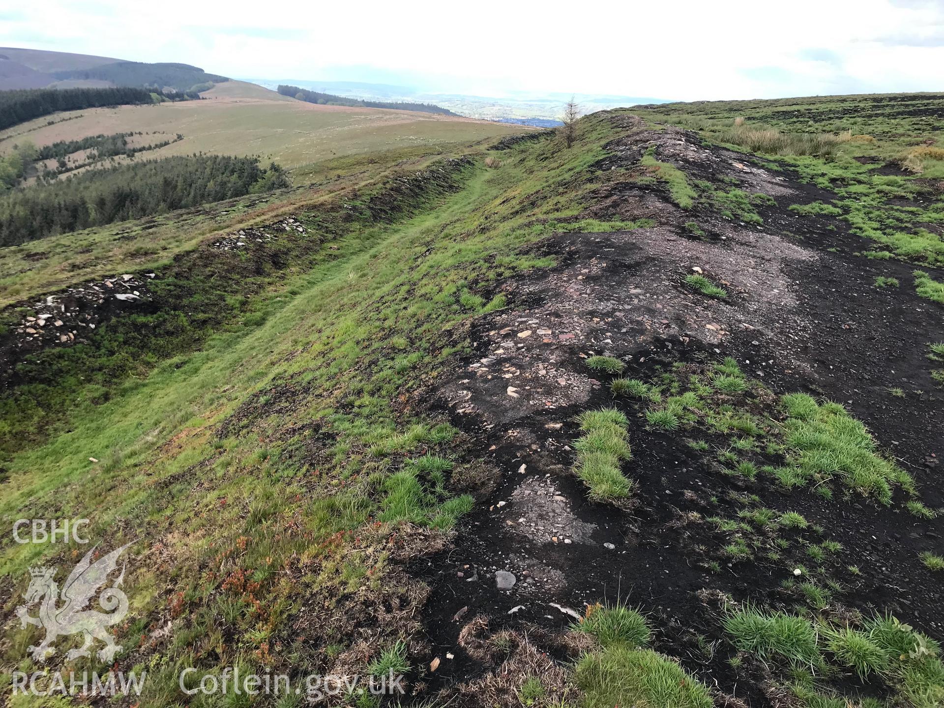 Digital colour photograph showing fire damage at Twmbarlwm Hillfort and Castle, Risca, taken by Paul R. Davis on 9th May 2019.