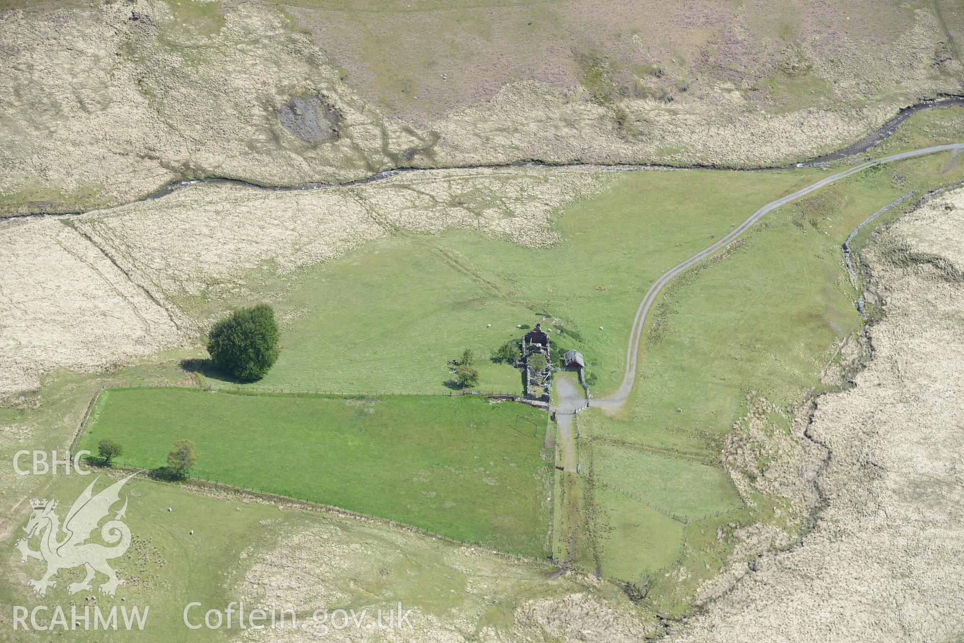 Lluest Aber Farmstead including the house(s), garden, barn and byer. Oblique aerial photograph taken during the Royal Commission's programme of archaeological aerial reconnaissance by Toby Driver on 3rd June 2018.