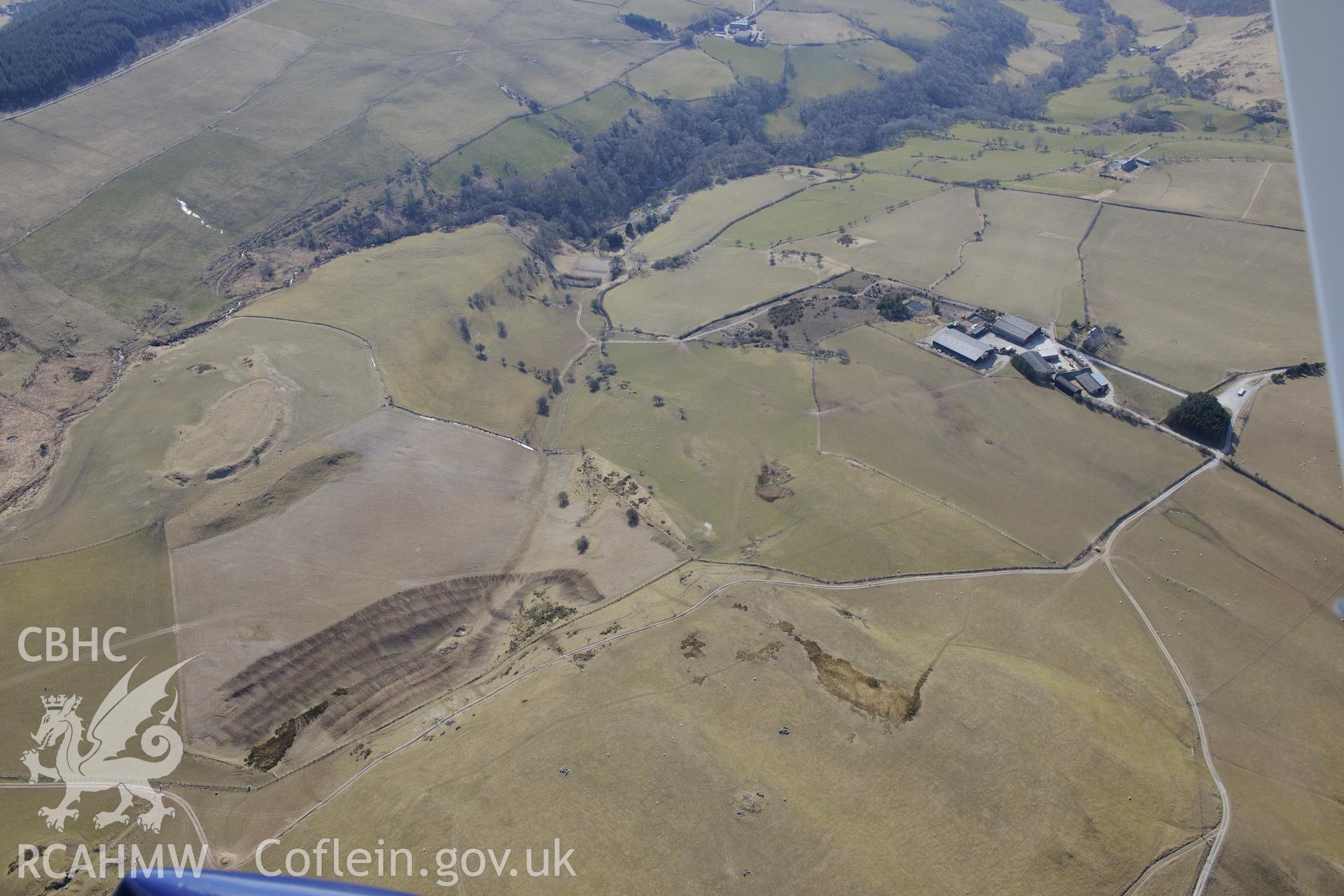 Pen-y-Castell and Banc Lletty Ifan Hen round barrow, Salem, north east of Aberystwyth. Oblique aerial photograph taken during the Royal Commission?s programme of archaeological aerial reconnaissance by Toby Driver on 2nd April 2015.