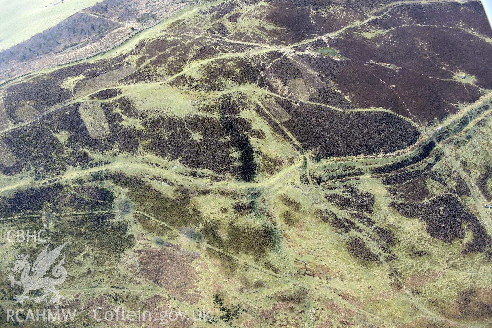 Penycloddiau hillfort, Llangwyfan. Oblique aerial photograph taken during the Royal Commission?s programme of archaeological aerial reconnaissance by Toby Driver on 28th February 2013.