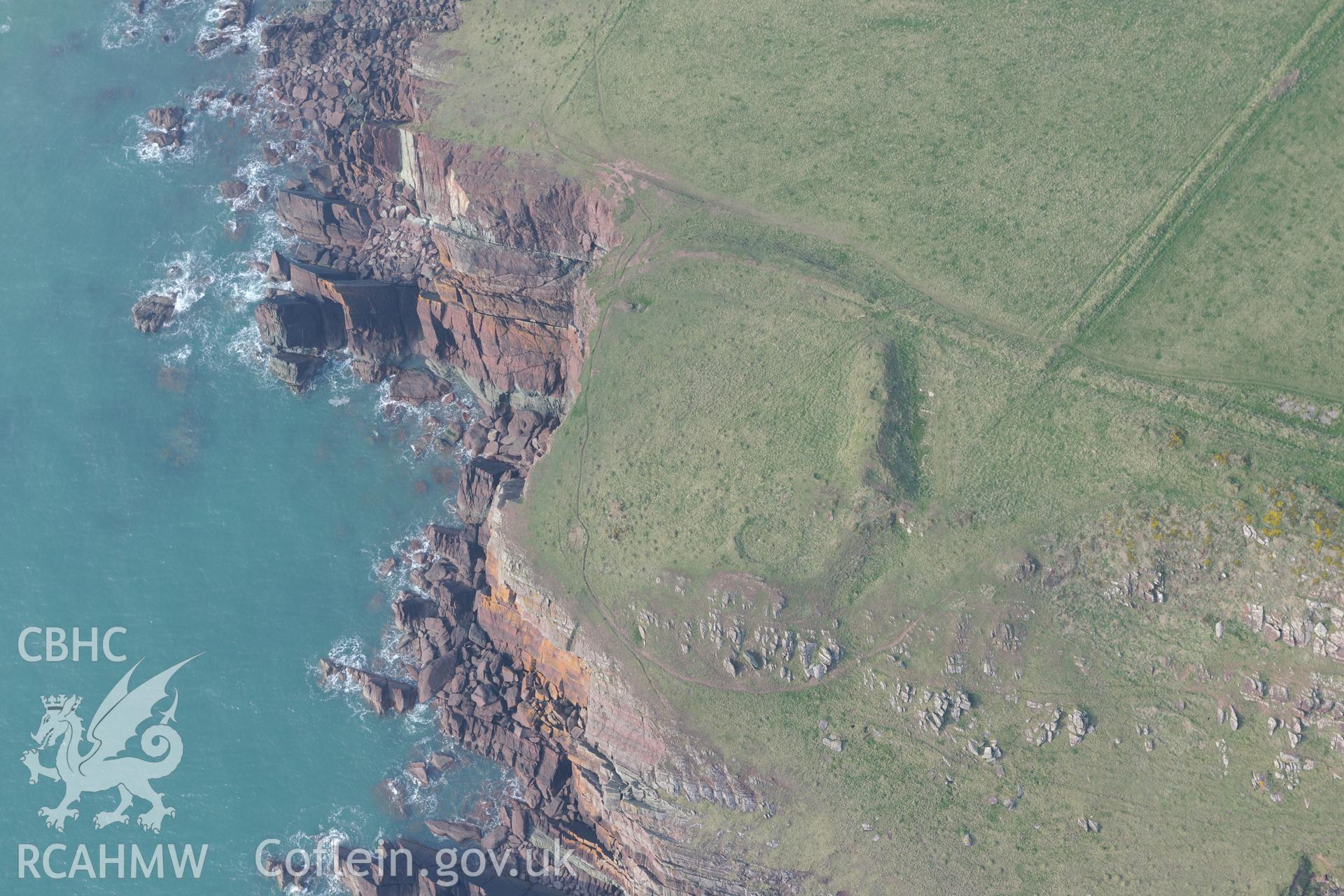 Aerial photography of West Pickard Bay promontory fort taken on 27th March 2017. Baseline aerial reconnaissance survey for the CHERISH Project. ? Crown: CHERISH PROJECT 2019. Produced with EU funds through the Ireland Wales Co-operation Programme 2014-2020. All material made freely available through the Open Government Licence.