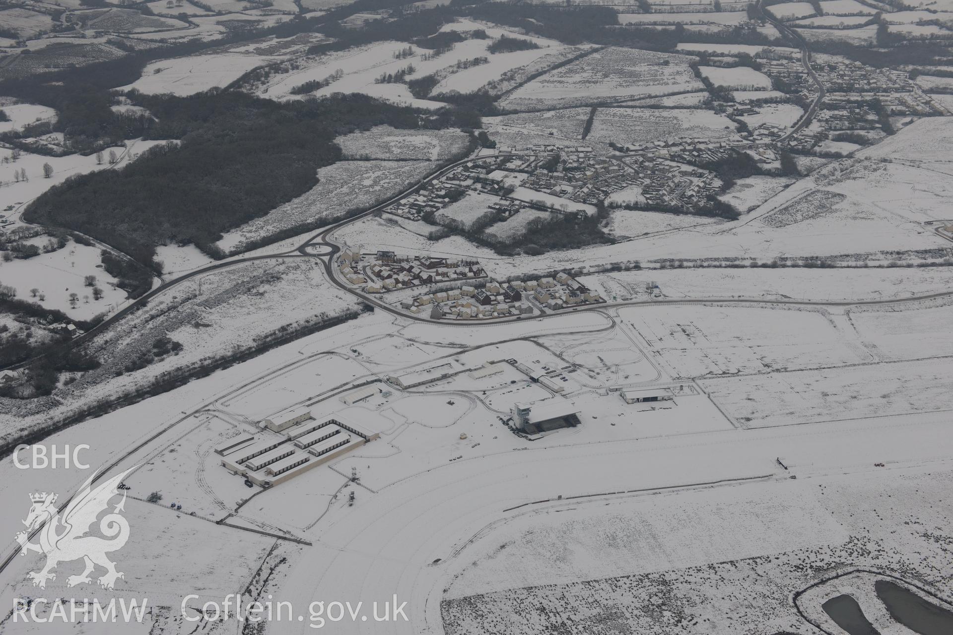 Ffos Las racecourse and Ffos Las solar farm, Trimsaran, north west of Llanelli. Oblique aerial photograph taken during the Royal Commission?s programme of archaeological aerial reconnaissance by Toby Driver on 24th January 2013.