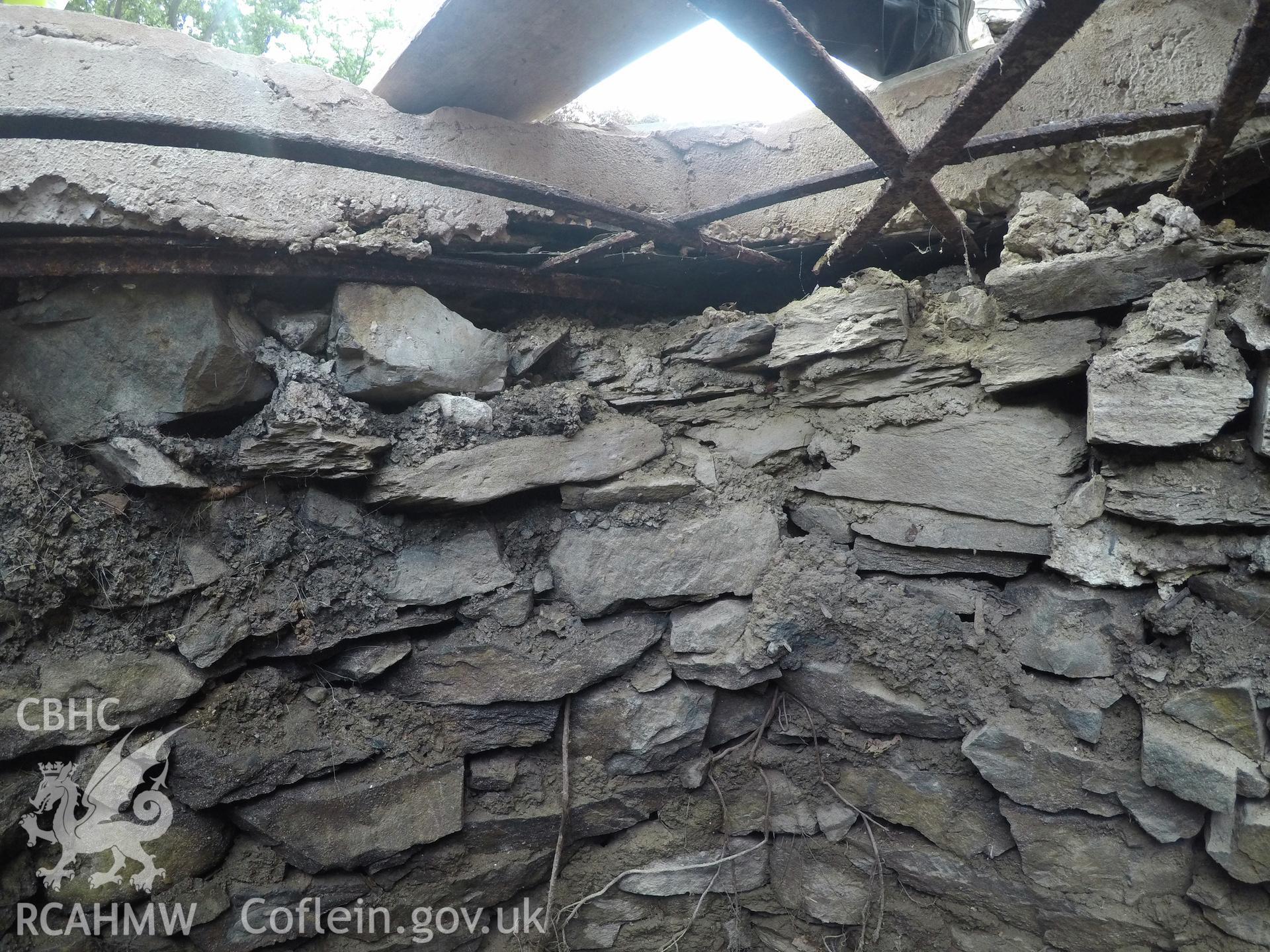 View from south of well interior at 0.4m depth. Photographed by Gwynedd Archaeological Trust as part of archaeological mitigation report for well at Plas Celynin, Henryd, Conwy, on 1st August 2018. Project no. G2568.