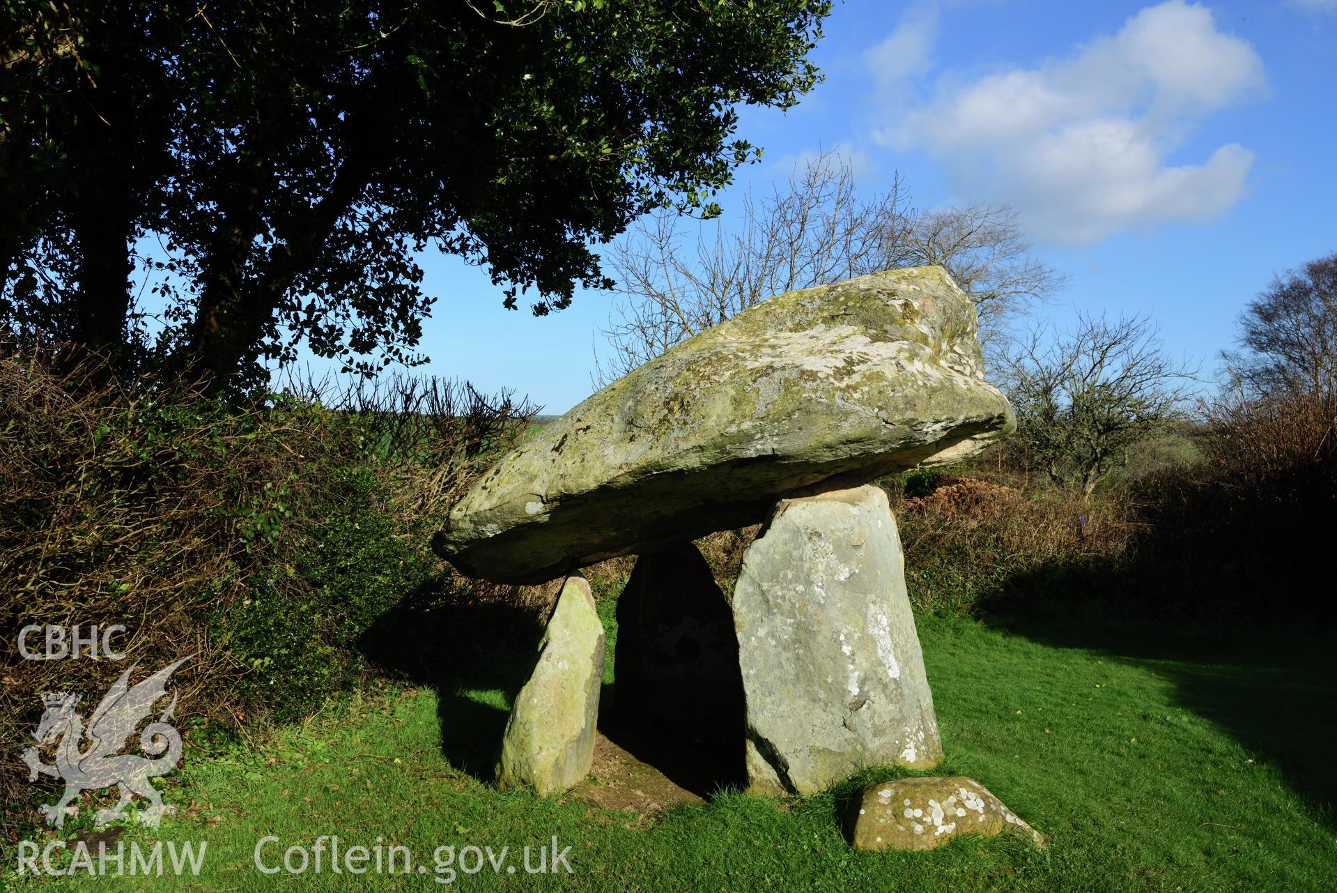 Royal Commission photo survey of Carreg Coetan chambered tomb in winter light, by Toby Driver
