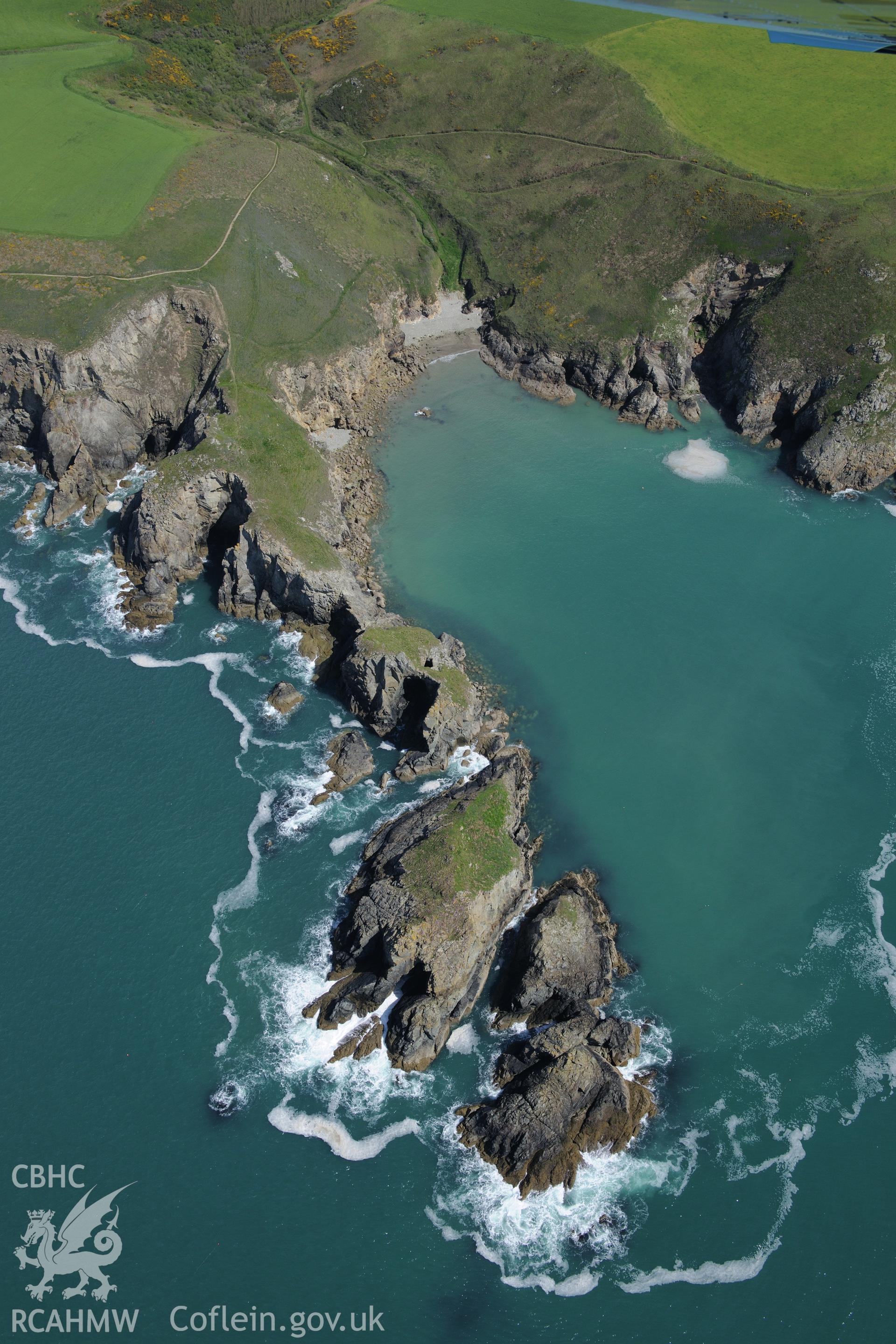 Dinas Fach defended enclosure and Porth Mynawyd landing place, Solva. Oblique aerial photograph taken during the Royal Commission's programme of archaeological aerial reconnaissance by Toby Driver on 13th May 2015.