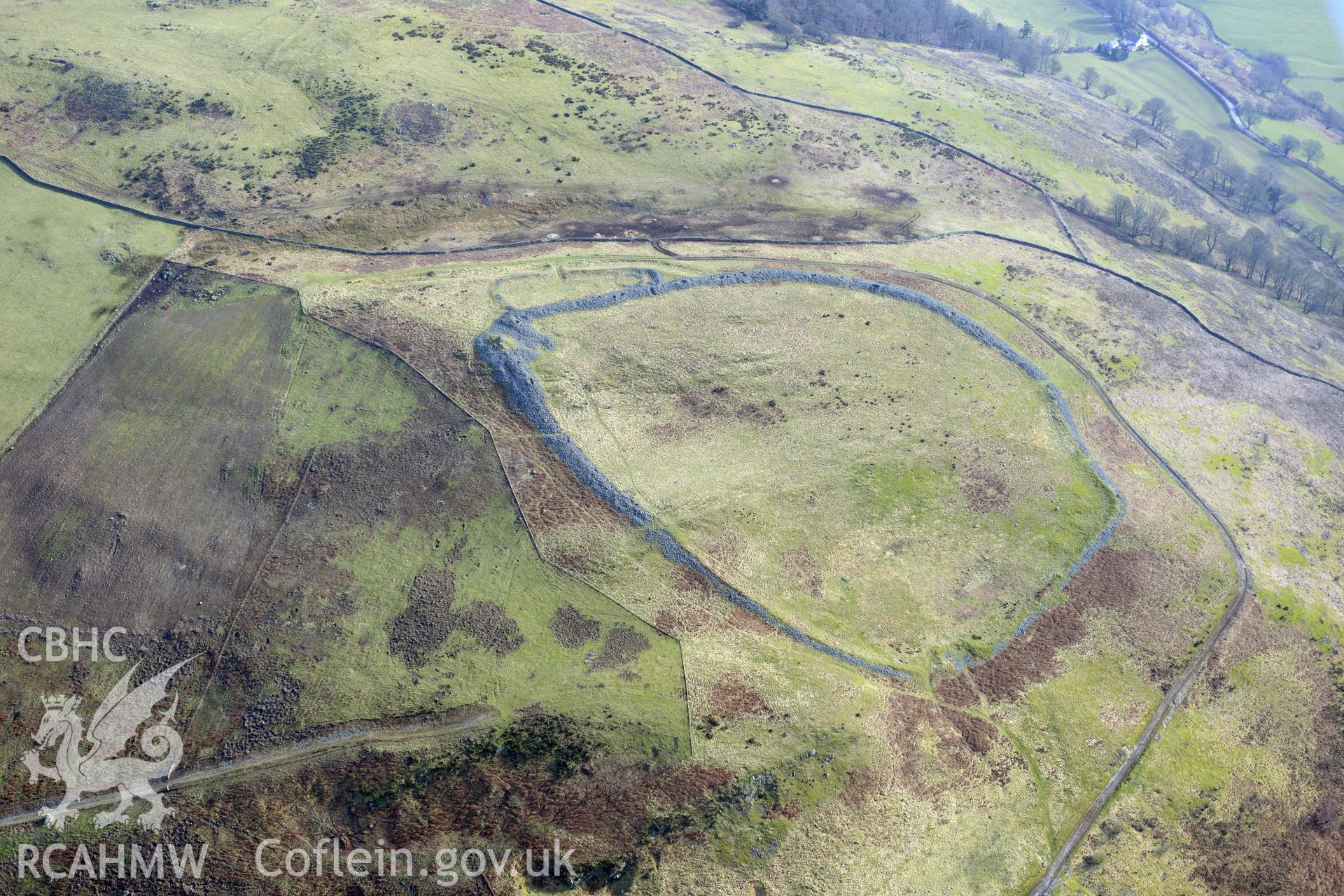 Caer Drewyn hillfort, Corwen, west of Llangollen. Oblique aerial photograph taken during the Royal Commission?s programme of archaeological aerial reconnaissance by Toby Driver on 28th February 2013.