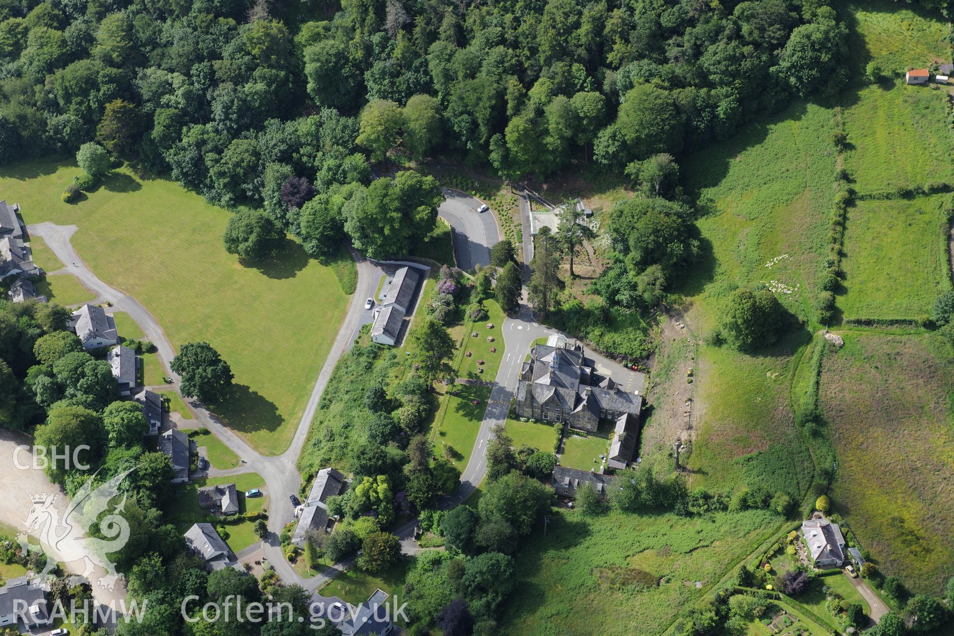 Plas Glyn-y-Weddw including the gardens, outbuildings and stables, Llanbedrog. Oblique aerial photograph taken during the Royal Commission's programme of archaeological aerial reconnaissance by Toby Driver on 23rd June 2015.