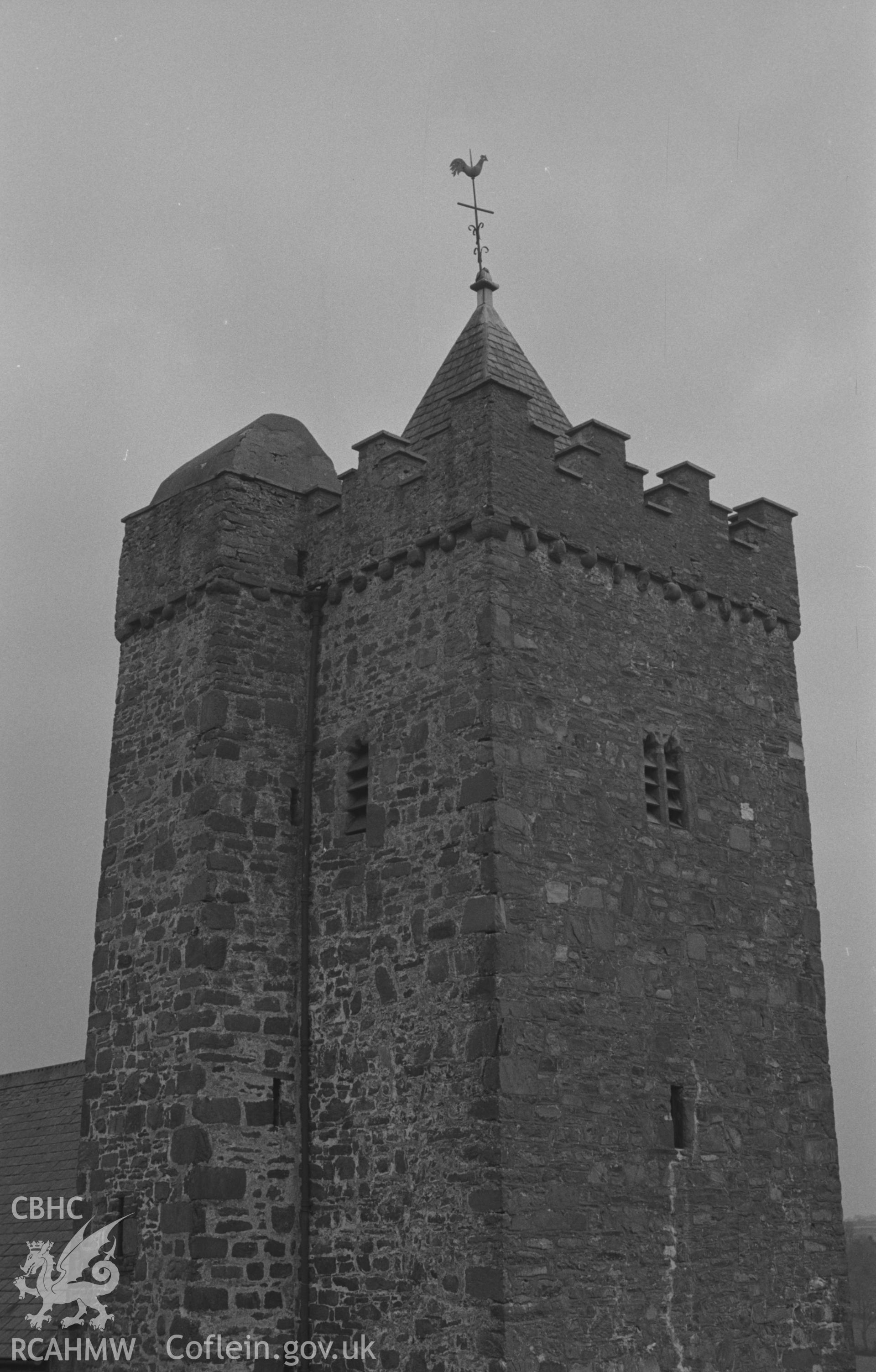 Digital copy of a black and white negative showing St. David's church tower and weathercock, Llanarth. Photographed by Arthur O. Chater on 13th April 1967 looking south west from Grid Reference SN 423 578.