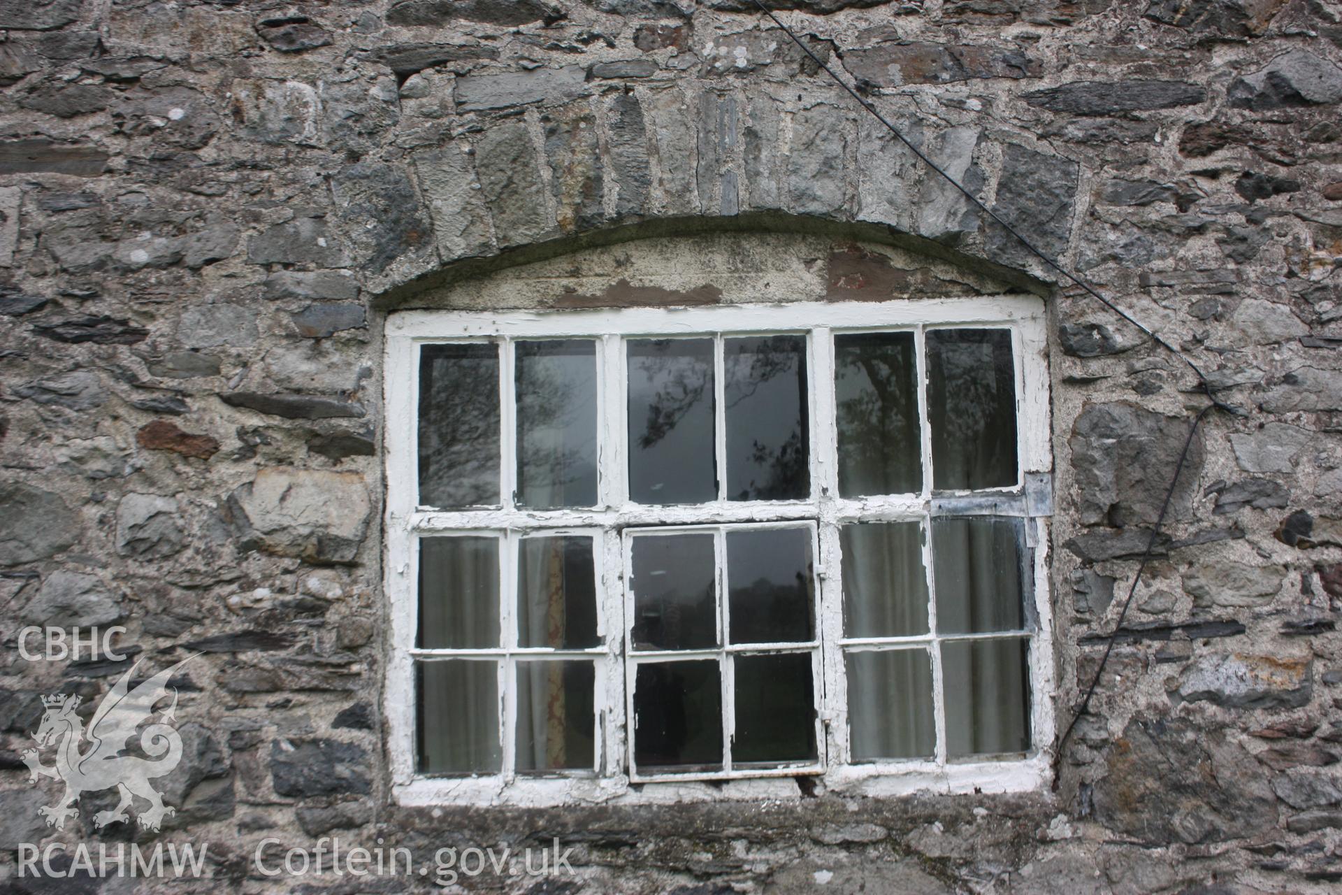 Exterior view of stone wall and glass paned window with wooden frame. Photographic survey of Glanhafon-Fawr Farmstead conducted by Geoff Ward on 4th November 2010.