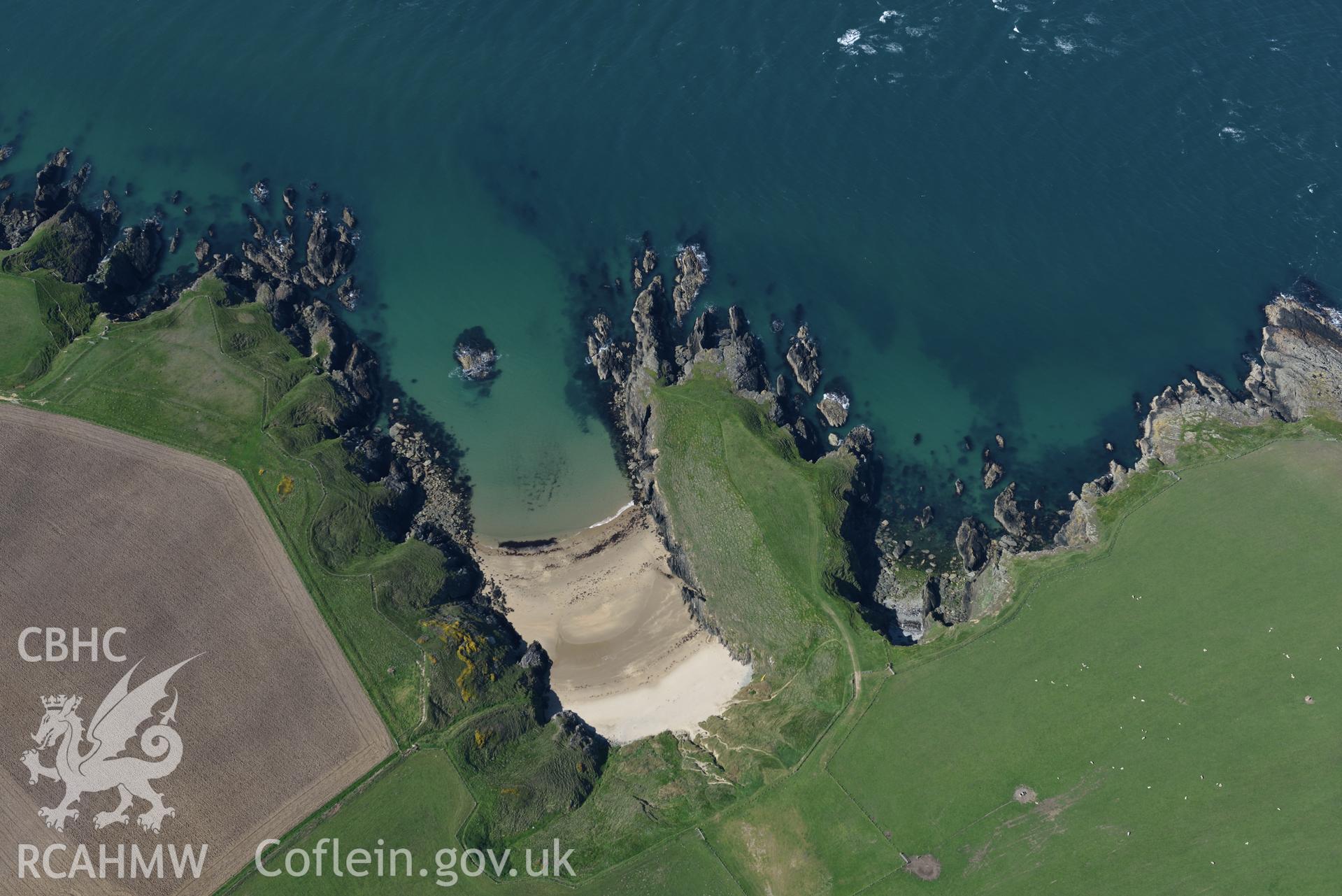 Aerial photography of Dinas promontory fort taken on 3rd May 2017.  Baseline aerial reconnaissance survey for the CHERISH Project. ? Crown: CHERISH PROJECT 2017. Produced with EU funds through the Ireland Wales Co-operation Programme 2014-2020. All material made freely available through the Open Government Licence.