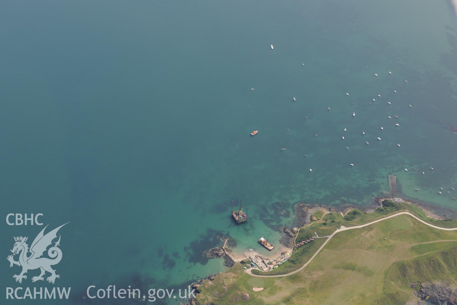 Lifeboat House, Lighthouse, Old Pier, Trwyn Porth Dinllaen Promontory Enclosure and Porth Dinllaen village. Oblique aerial photograph taken during the Royal Commission?s programme of archaeological aerial reconnaissance by Toby Driver on 12th July 2013.