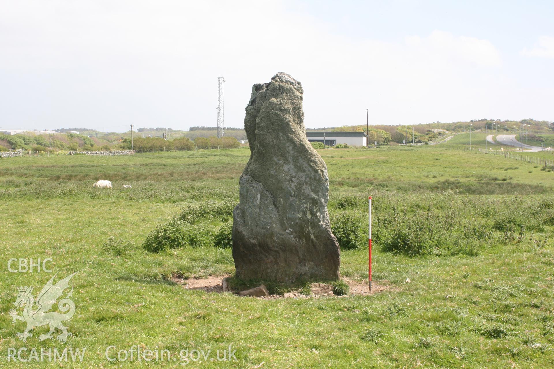 View of Ty-Mawr Standing Stone, from the northeast. Looking towards the Truckstop and HGV parking. Digital photograph taken as part of archaeological work at Parc Cybi Enterprise Zone, Holyhead, carried out by Archaeology Wales, 2017. Project no: P2522.