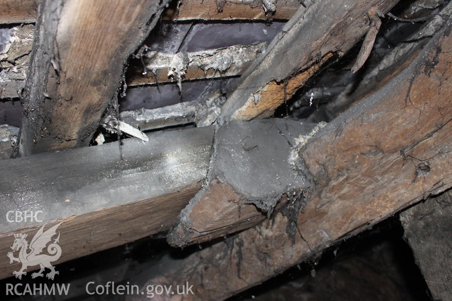 Colour photograph showing detail of timber frame and interior of roof in attic at 5 to 7 Mwrog Street, Ruthin. Photographed during survey conducted by Geoff Ward on 30th May 2014.