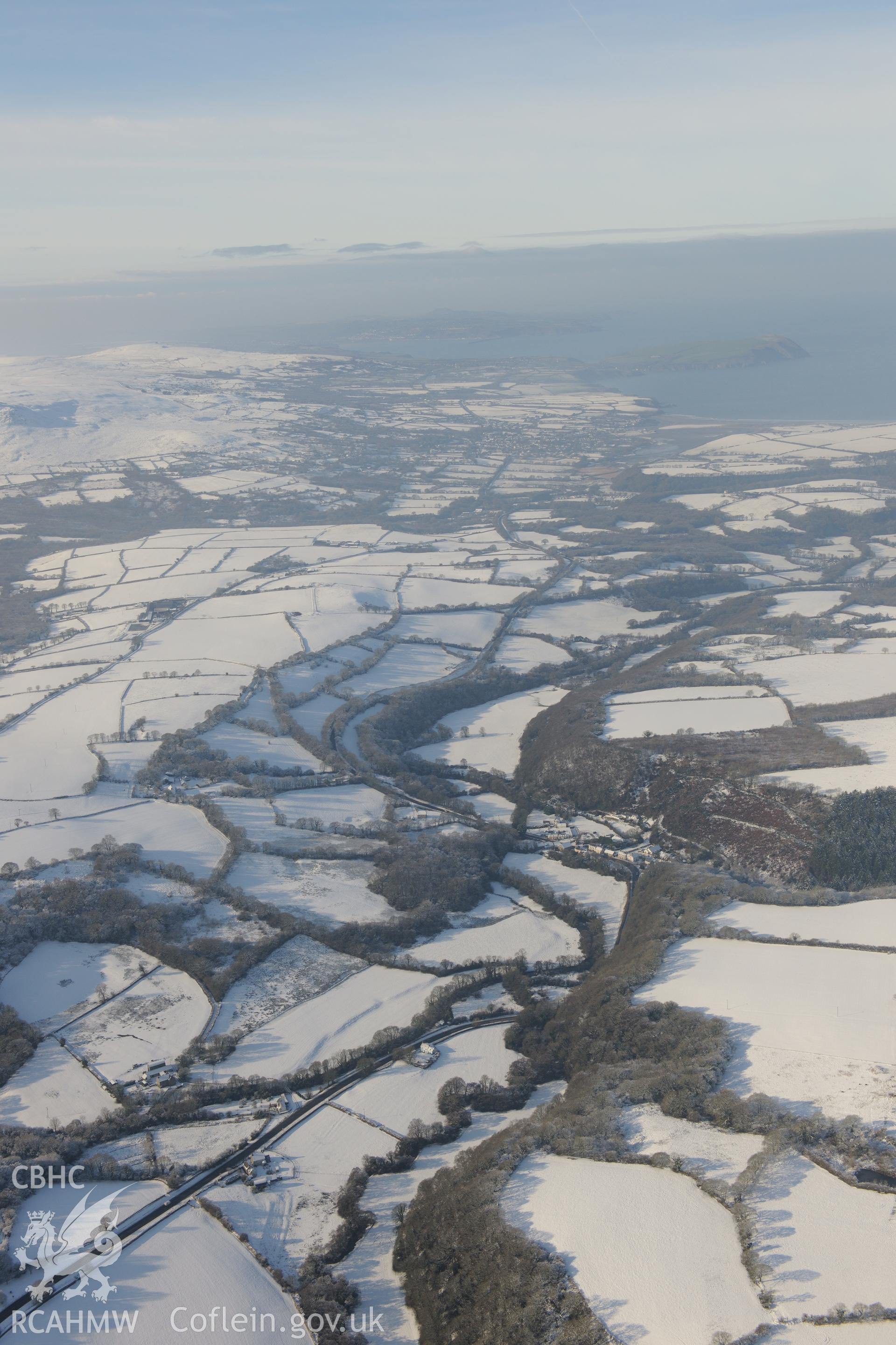 Felindre Farchog, south west of Cardigan. Oblique aerial photograph taken during the Royal Commission?s programme of archaeological aerial reconnaissance by Toby Driver on 24th January 2013.