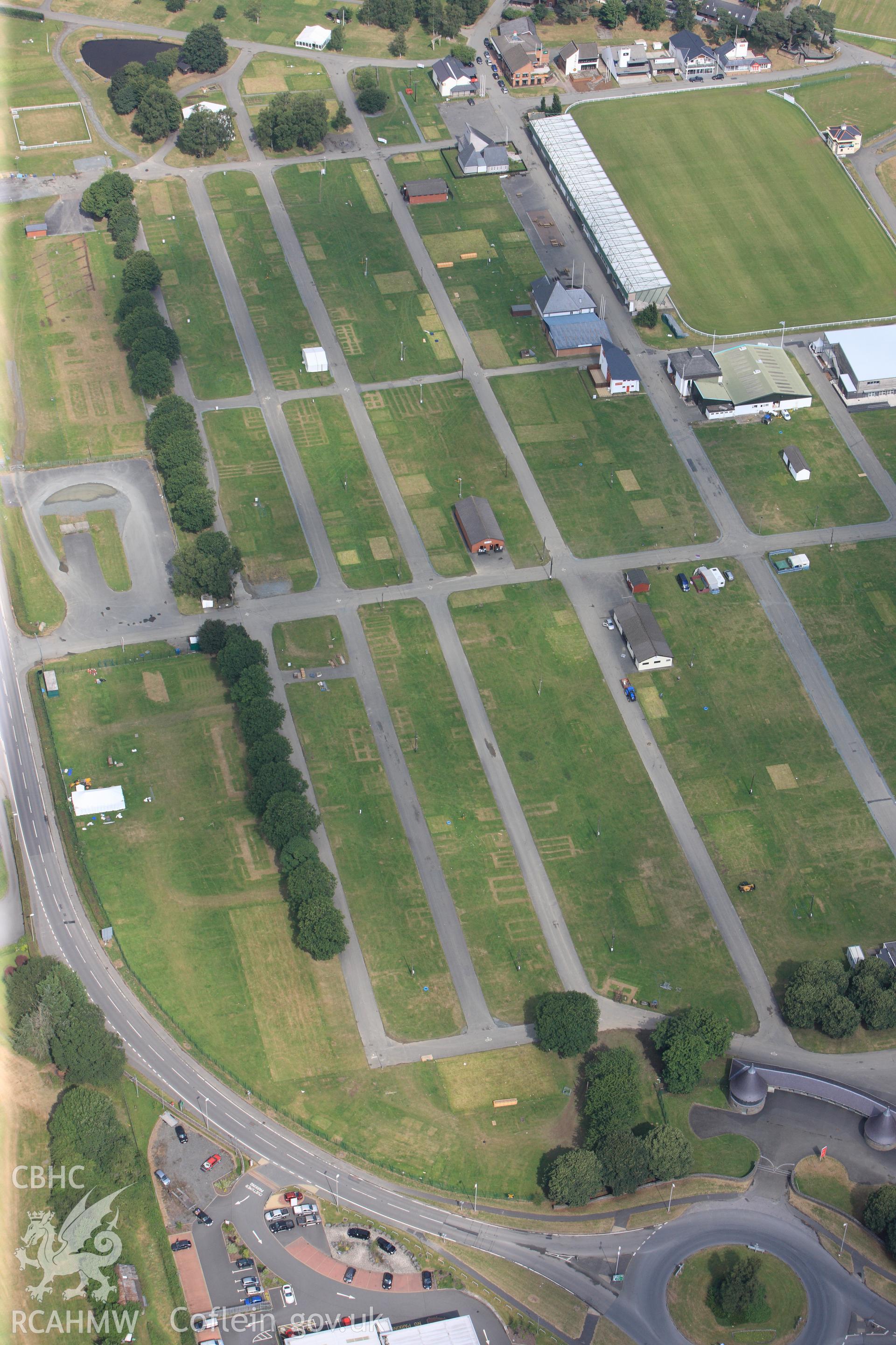 The Royal Welsh Showground, Llanelwedd. Oblique aerial photograph taken during the Royal Commission?s programme of archaeological aerial reconnaissance by Toby Driver on 1st August 2013.