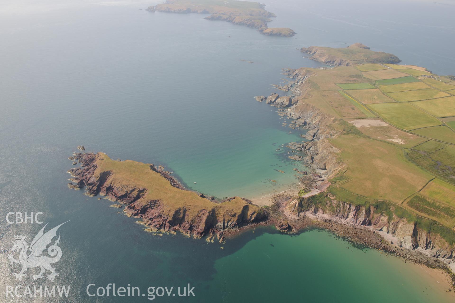 Gateholm Island and the wreck of Albion on Albion Sands, west of Milford Haven. Oblique aerial photograph taken during the Royal Commission?s programme of archaeological aerial reconnaissance by Toby Driver on 16th July 2013.