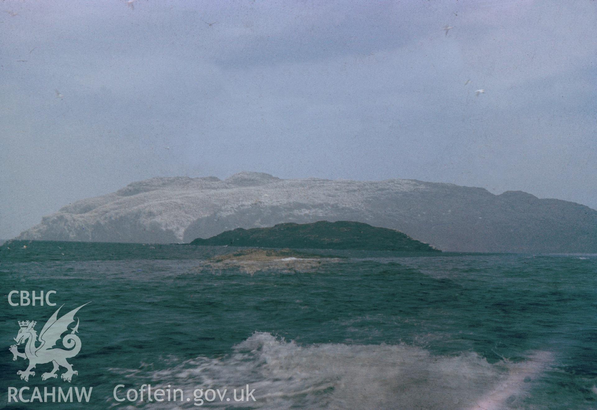 Digital copy of a colour slide showing Grassholm Island, taken by Douglas Hague, August 1972.