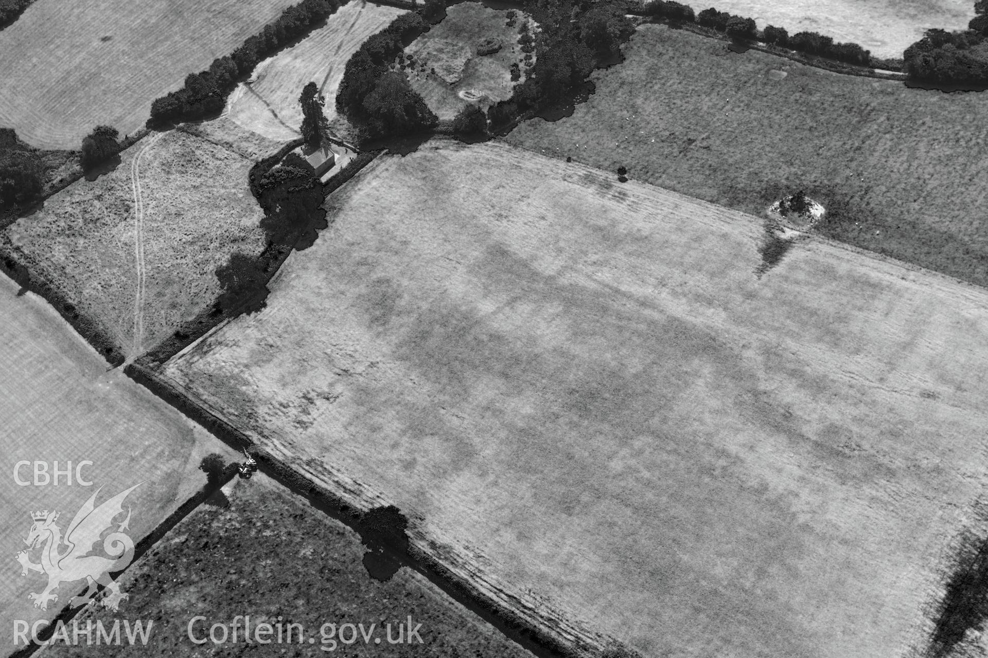 St. Mary's church, Penterry, near Tintern, and a prehistoric defended enclosure in the field immediately to its north. Oblique aerial photograph taken during the Royal Commission?s programme of archaeological aerial reconnaissance by Toby Driver on 1st August 2013.